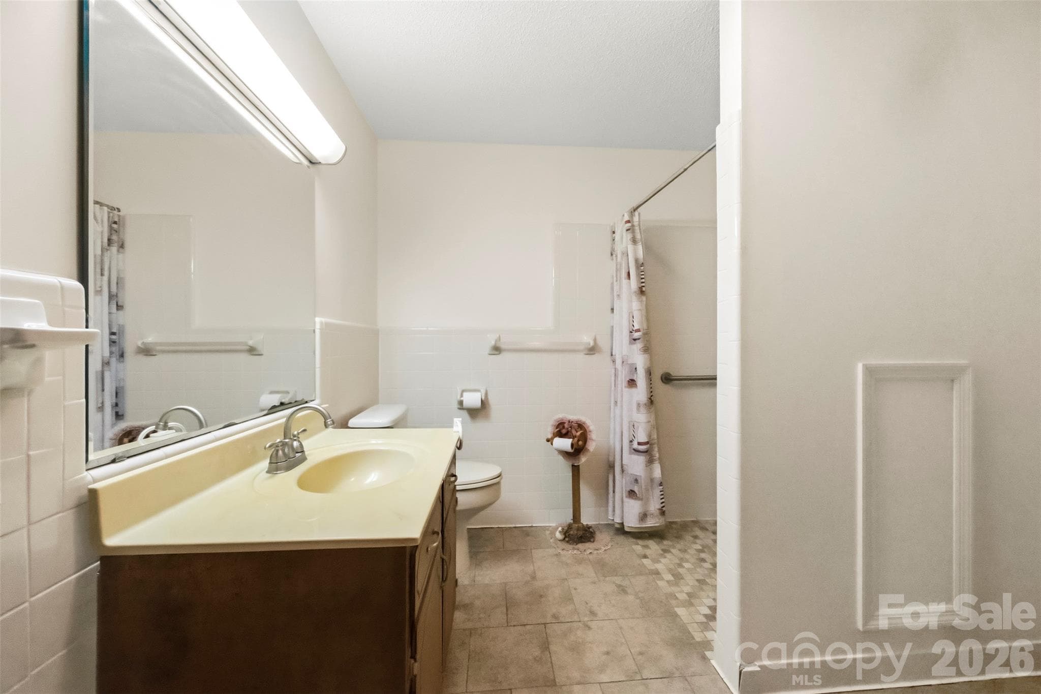 Large bathroom is part of the addition.  There is an accessible, zero entry shower with grab bars. - 2925 Fallston Waco Road, Shelby