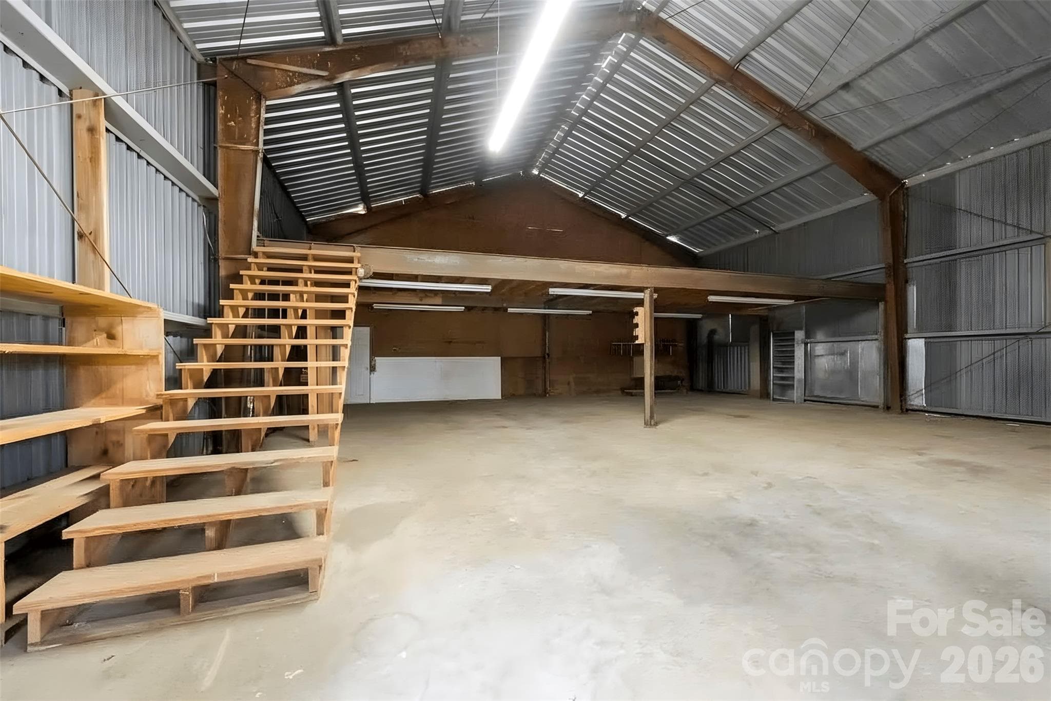 One side of shop building has stairs to a loft - 2925 Fallston Waco Road, Shelby