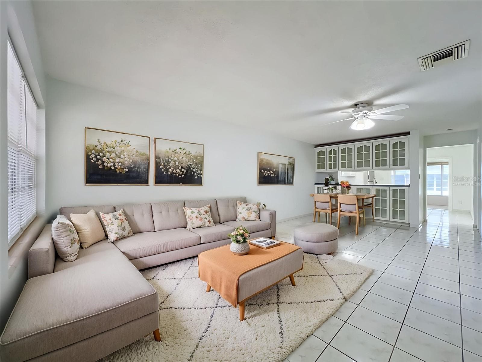 Virtually staged to showcase the possibilities of the spacious living and dining area. - 1225 CARRIAGE LN #1, ORLANDO