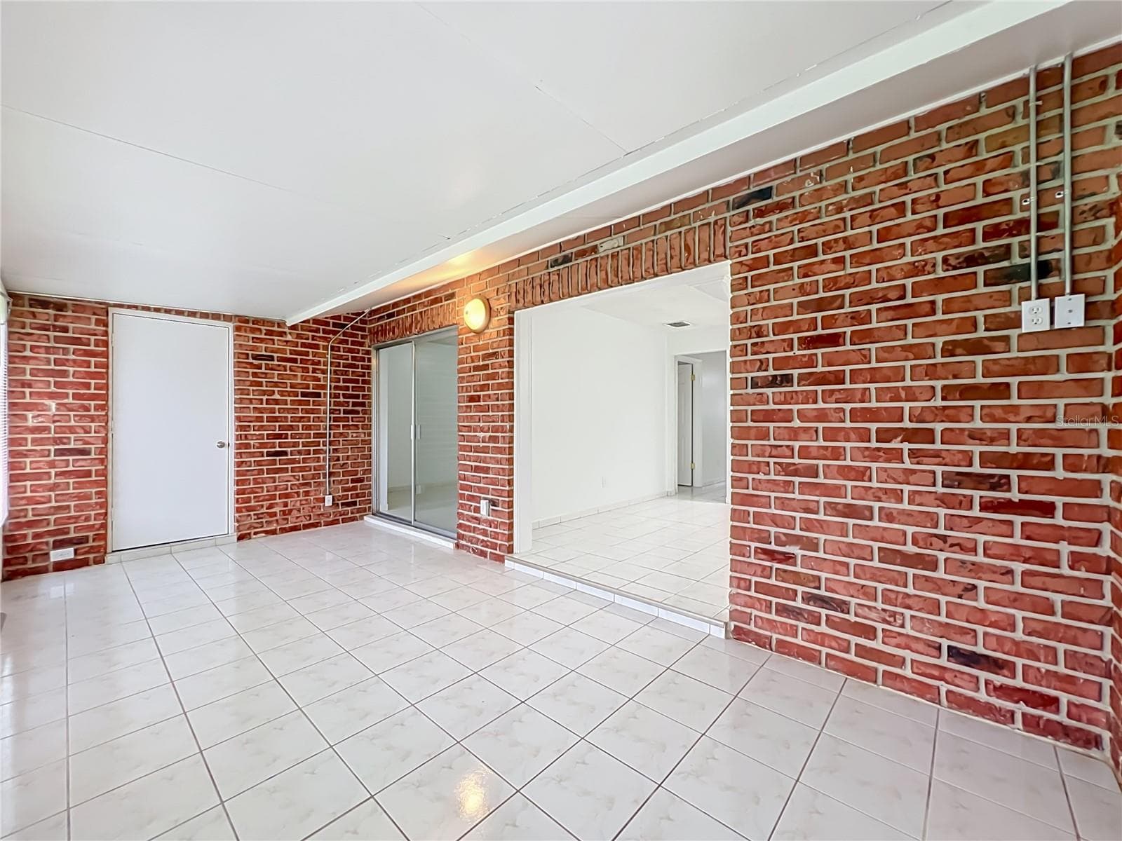 One of the home's highlights — a spacious Florida room offering endless possibilities. - 1225 CARRIAGE LN #1, ORLANDO