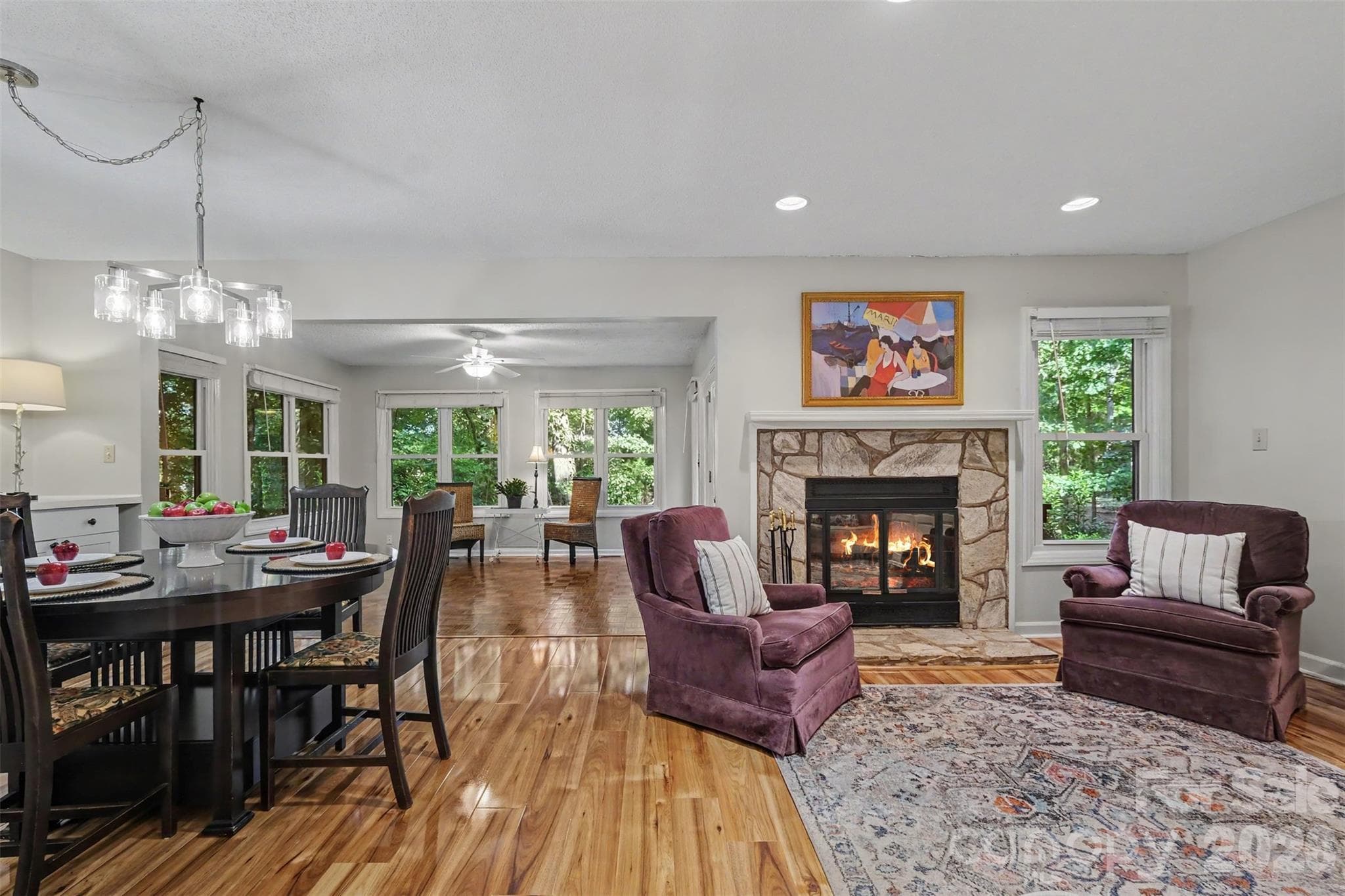 Open living and dining area flow into the sunroom - 2786 Dogwood Hills Court, Fort Mill