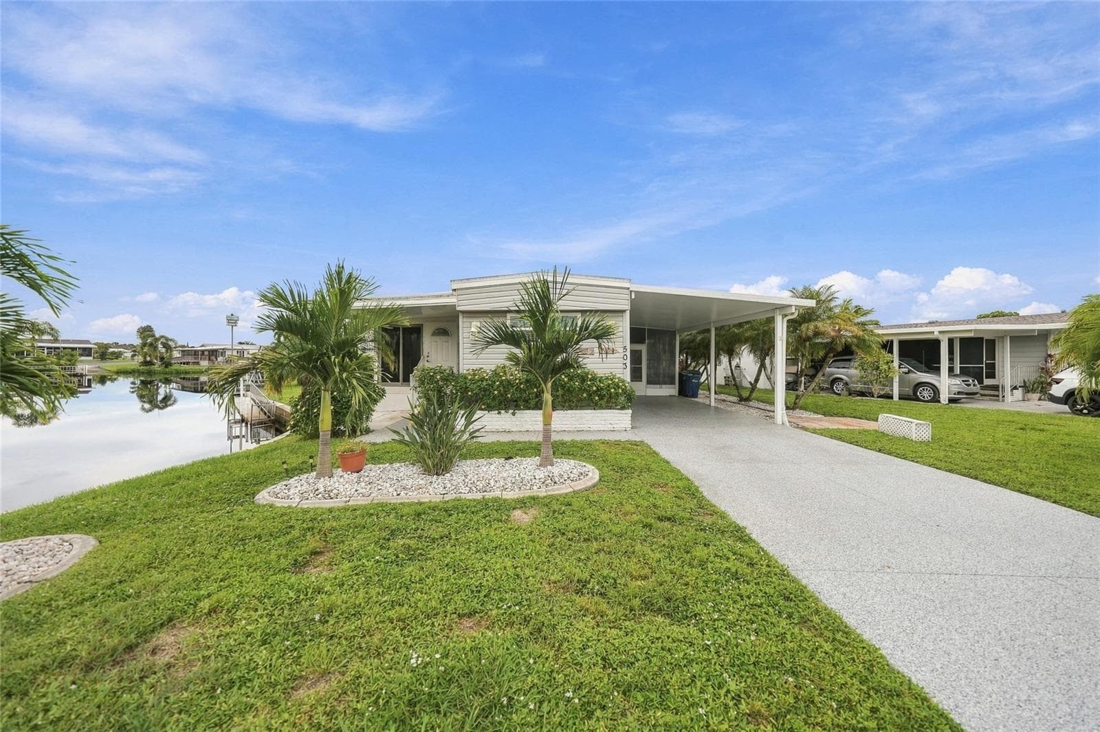Front of Home with Long Driveway - 503 ALJO PL, NORTH PORT