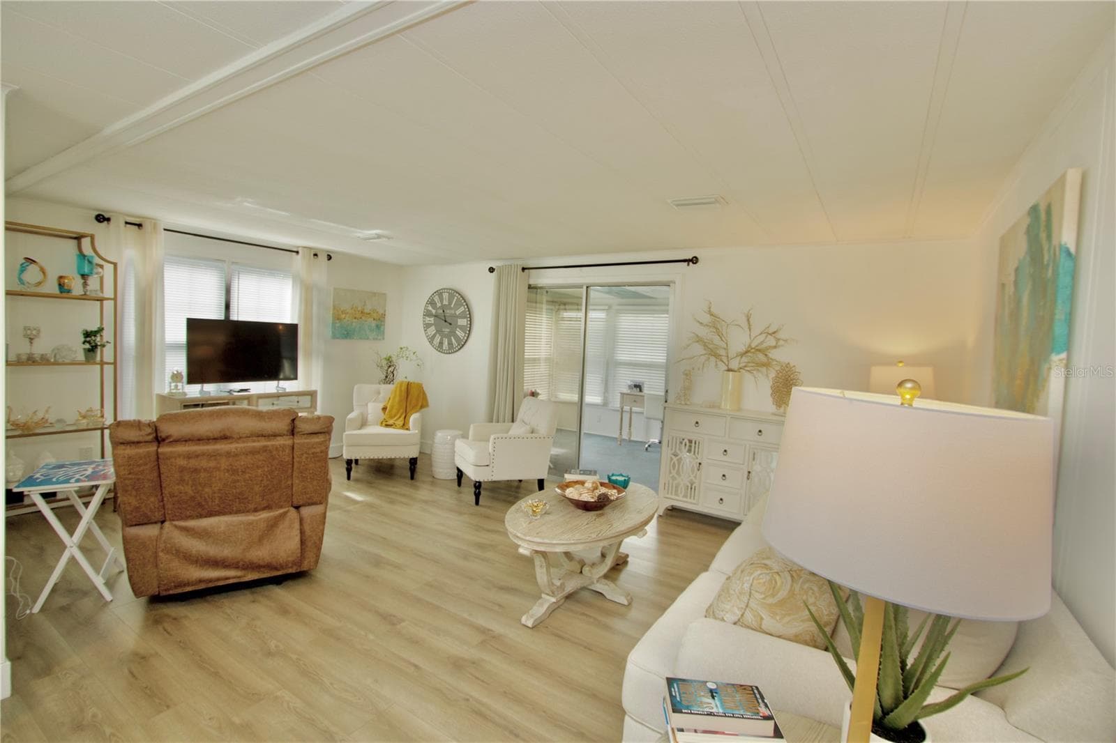Living Room With Sliders Leading to Sunroom - 5005 FRENCH CIR, NEW PORT RICHEY