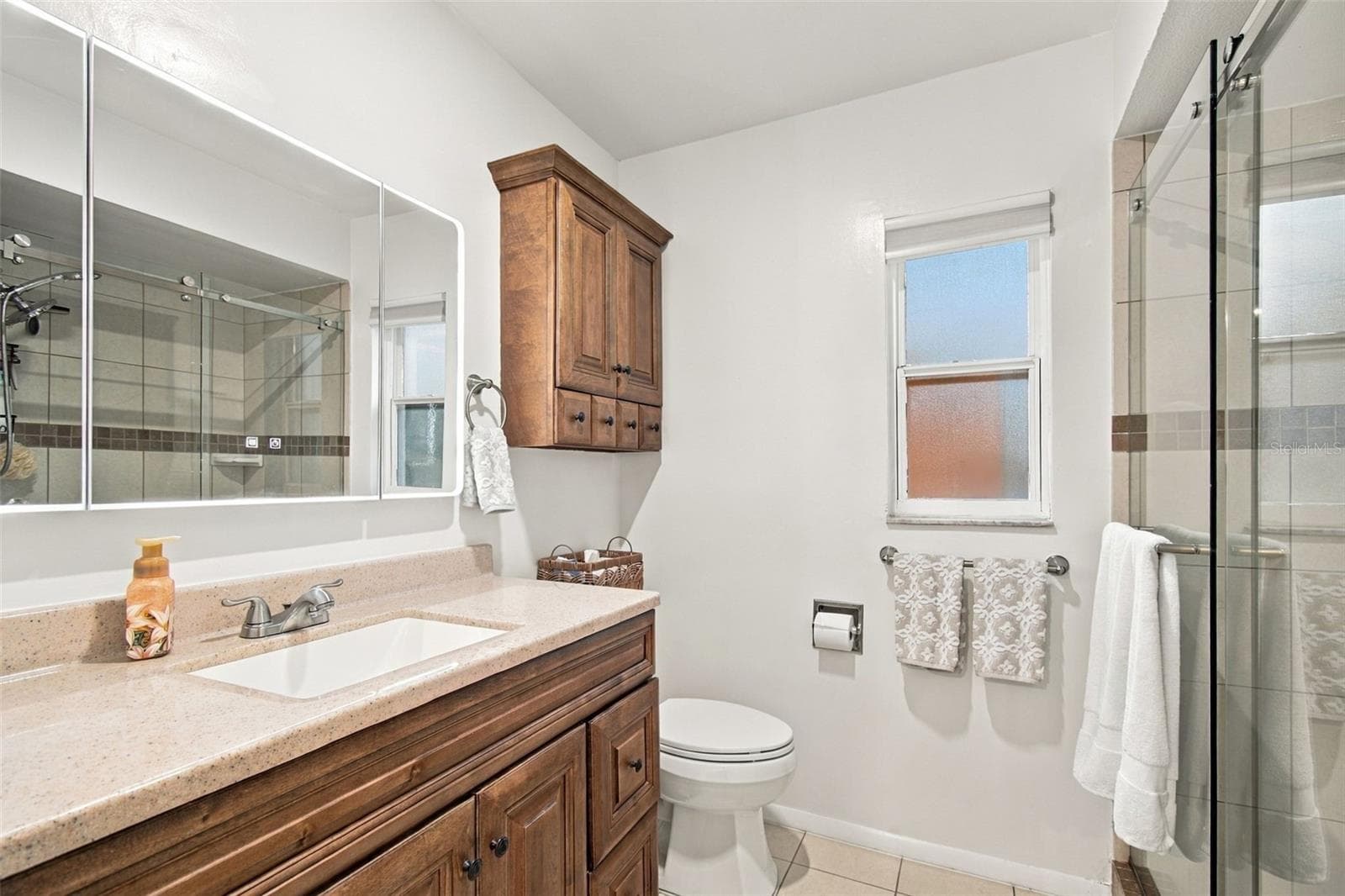 CUSTOM CABINETRY IN ENSUITE BATHROOM - 14304 91ST AVE, SEMINOLE