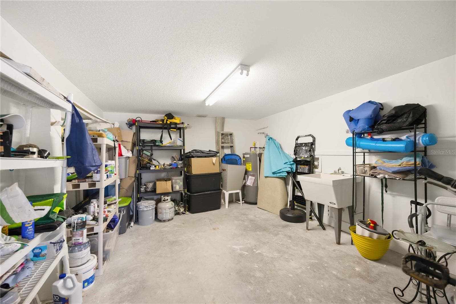 large storage room inside carport / electrical and plumbing - 4260 PLACIDA RD #17A, ENGLEWOOD