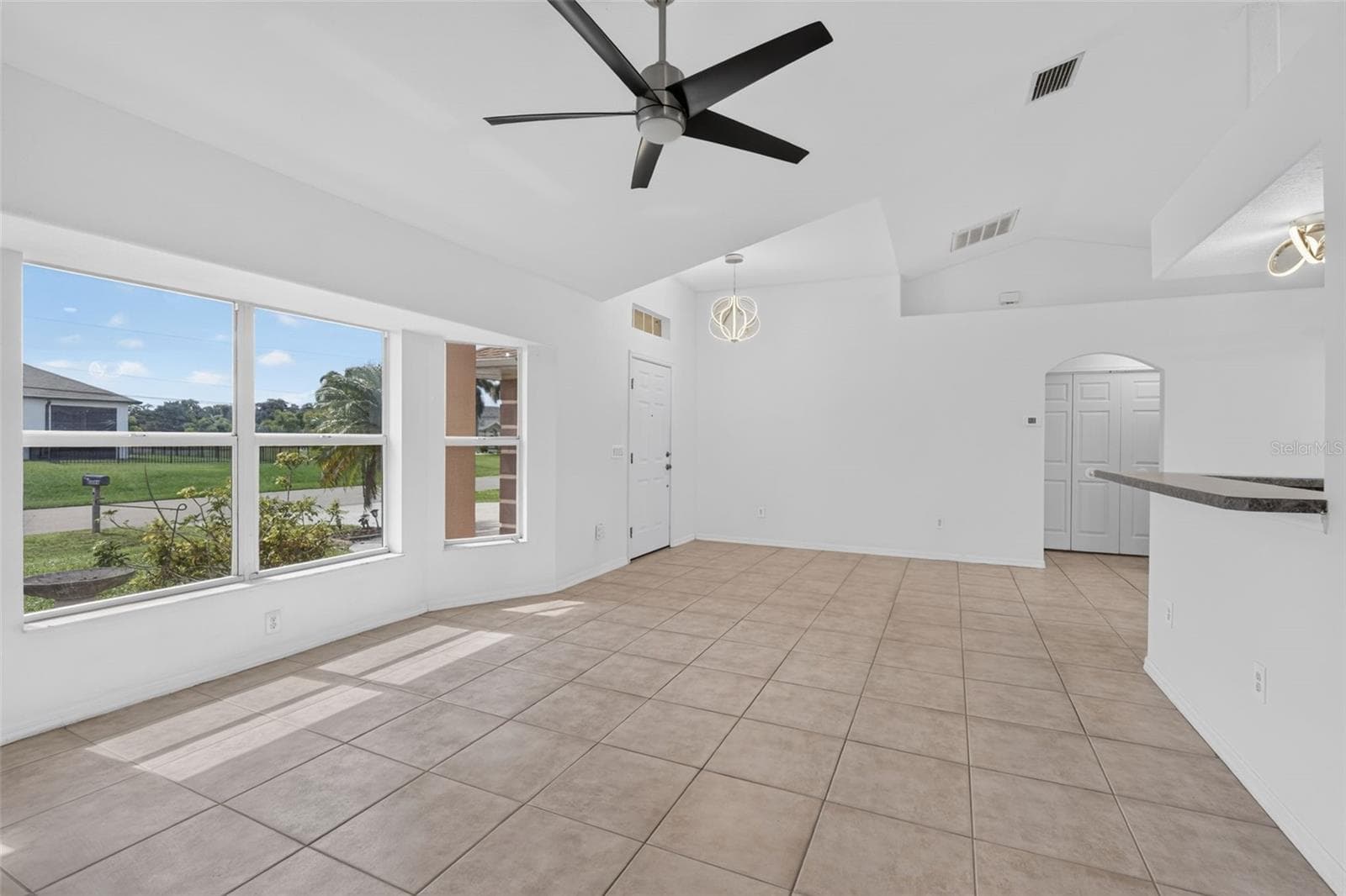 Living Room and Entry Area (Tinted Windows) - 2184 ONONDAGA LN, PUNTA GORDA