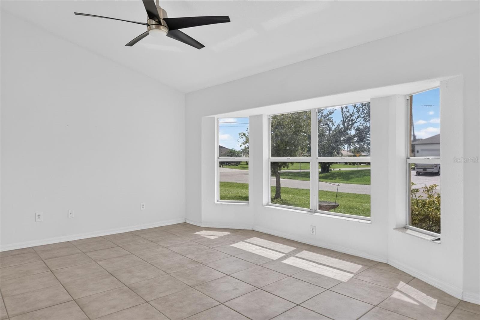Living Room - Another View (Tinted Windows) - 2184 ONONDAGA LN, PUNTA GORDA