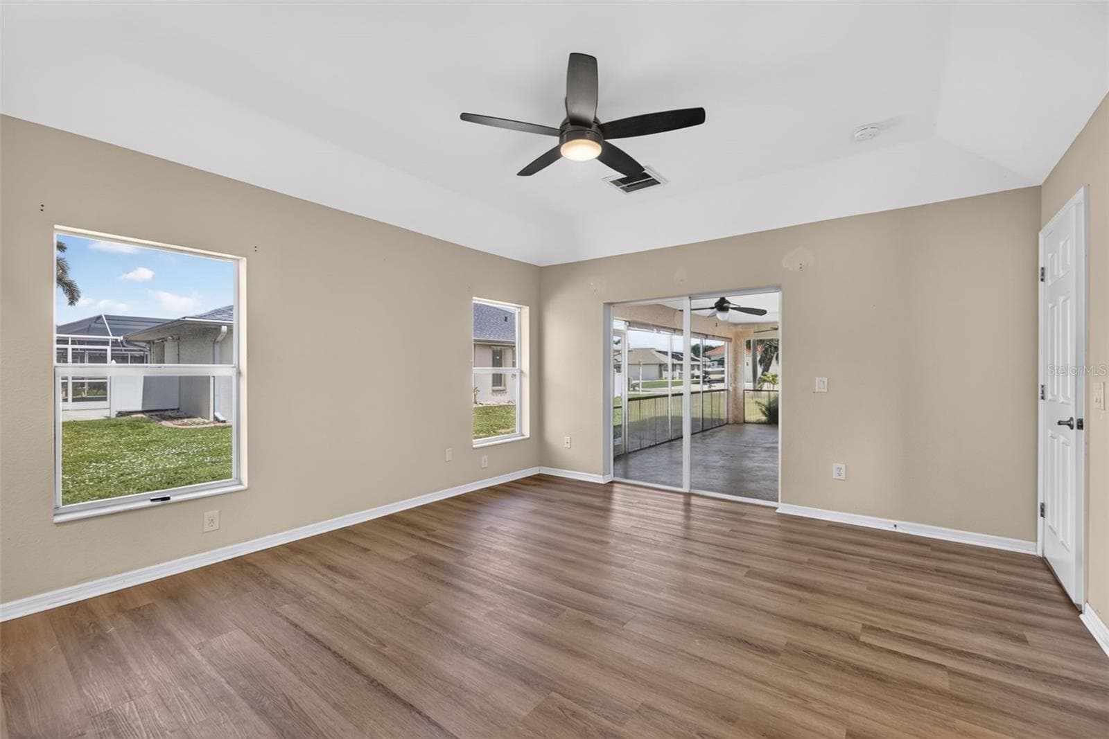 Primary Bedroom - Another View (Hide-a-way Sliders onto Lanai) - 2184 ONONDAGA LN, PUNTA GORDA