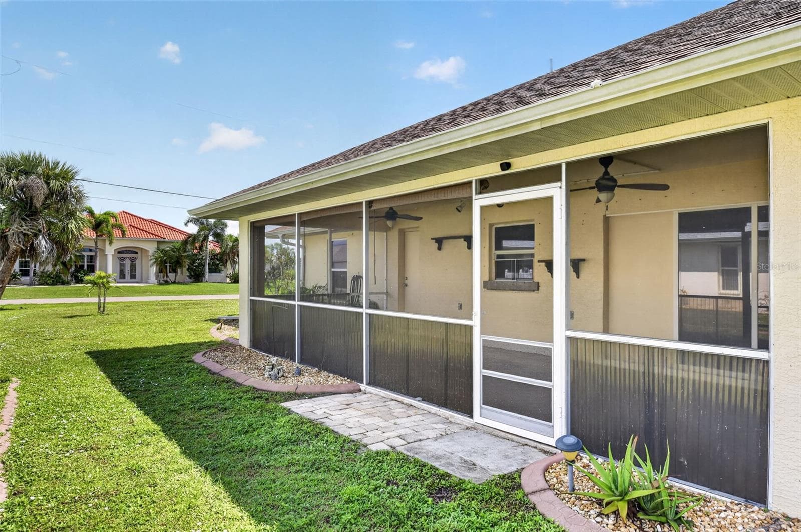 Rear Yard View - West Elevation - 2184 ONONDAGA LN, PUNTA GORDA
