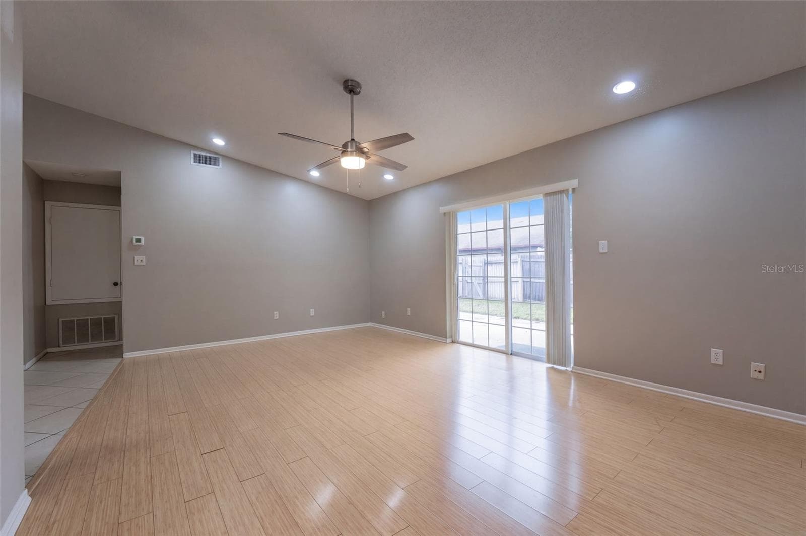 Great Room showing Sliders to Backyard and Lanai - 102 OAKRIDGE CT, SANFORD