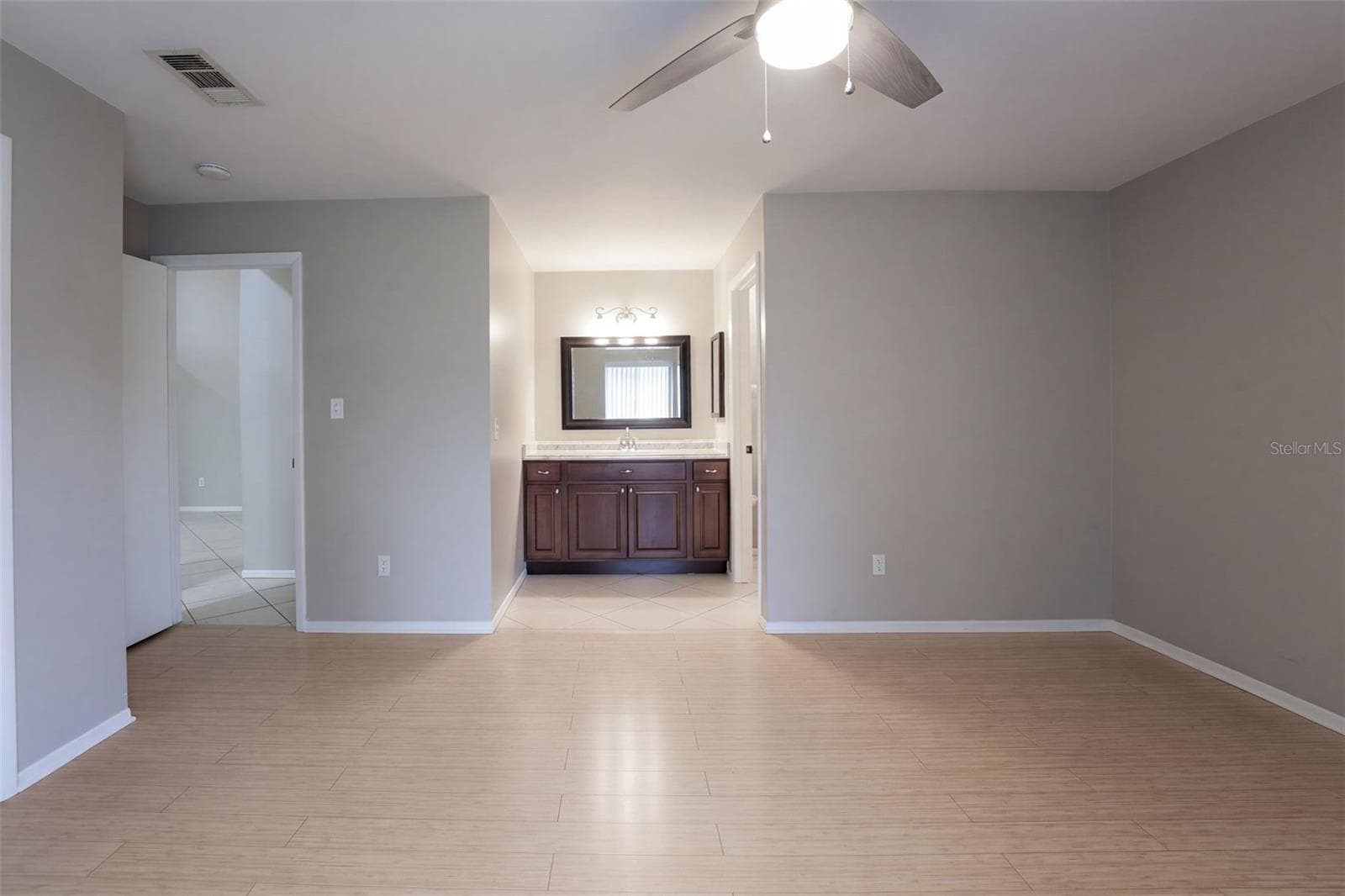 Primary Bedroom showing Vanity to Bath - 102 OAKRIDGE CT, SANFORD