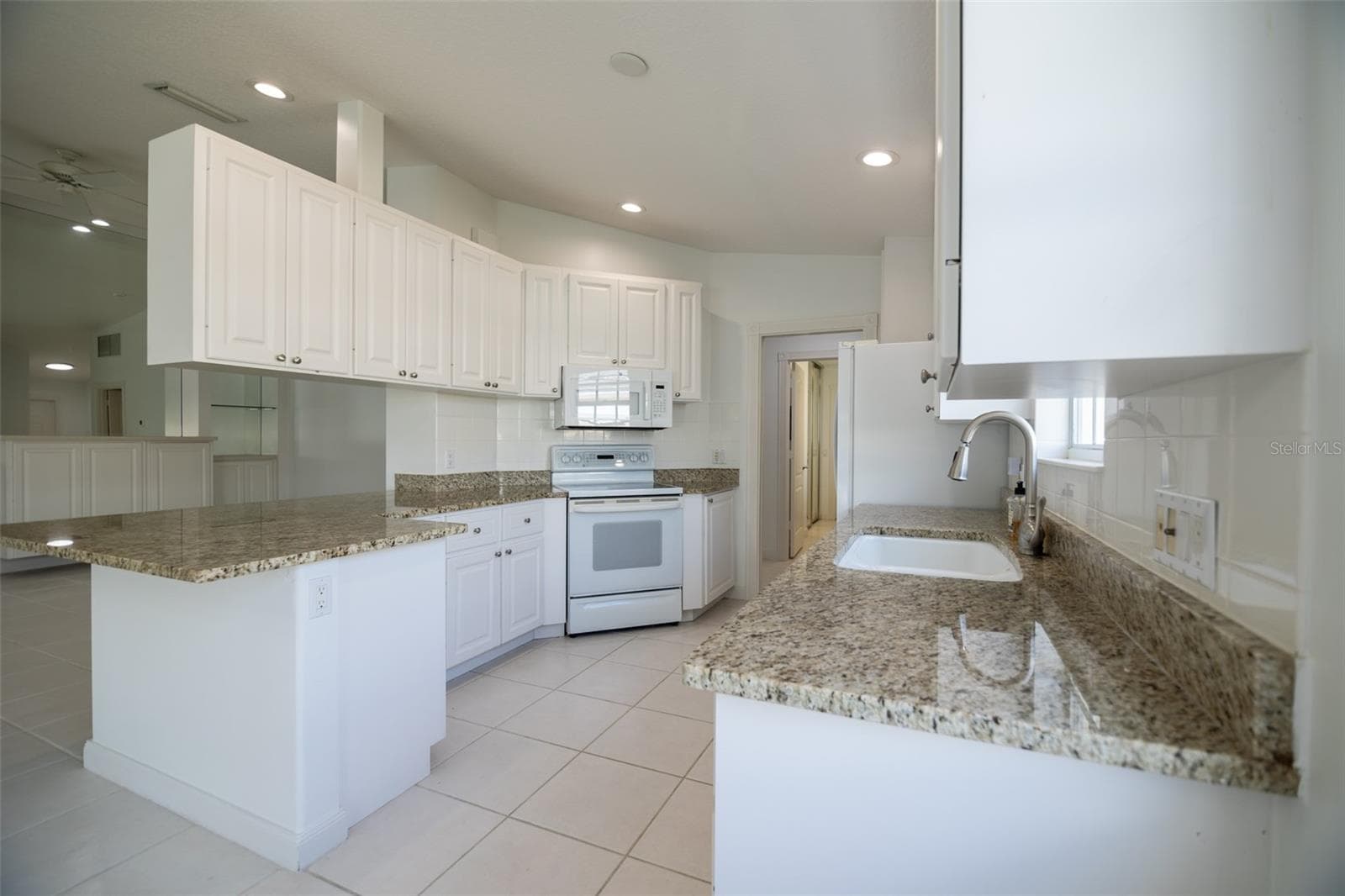Kitchen with view of formal living room. - 8876 ESTEPONA CT, SARASOTA