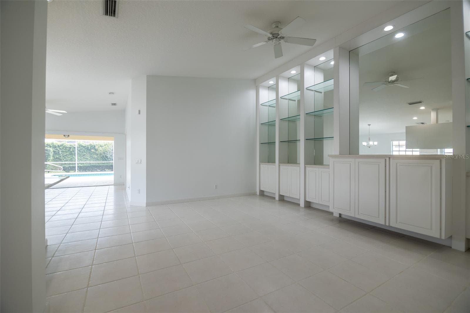 Formal living room with view of the pool. - 8876 ESTEPONA CT, SARASOTA