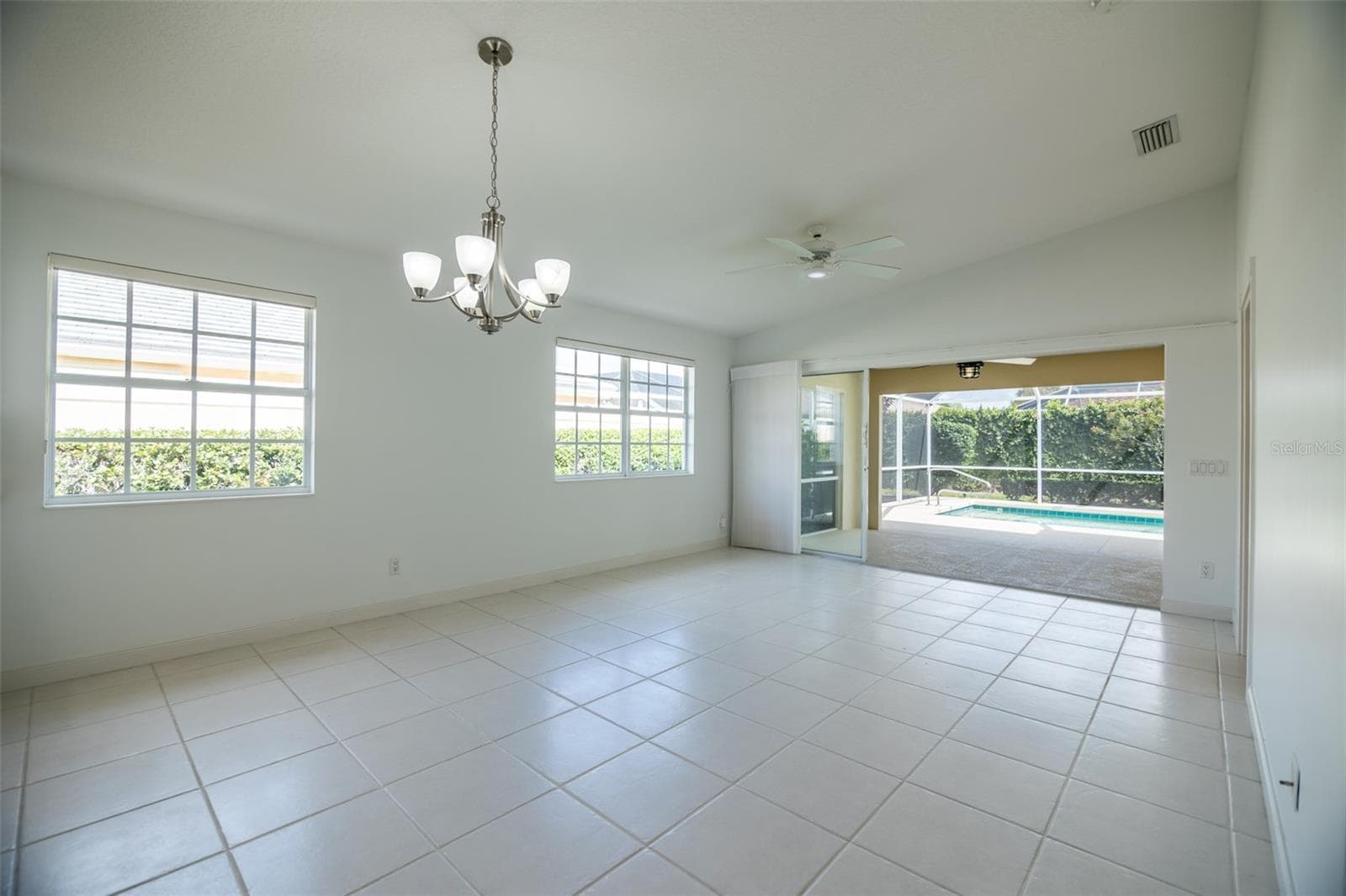 Dining and or living room with views to the pool. - 8876 ESTEPONA CT, SARASOTA