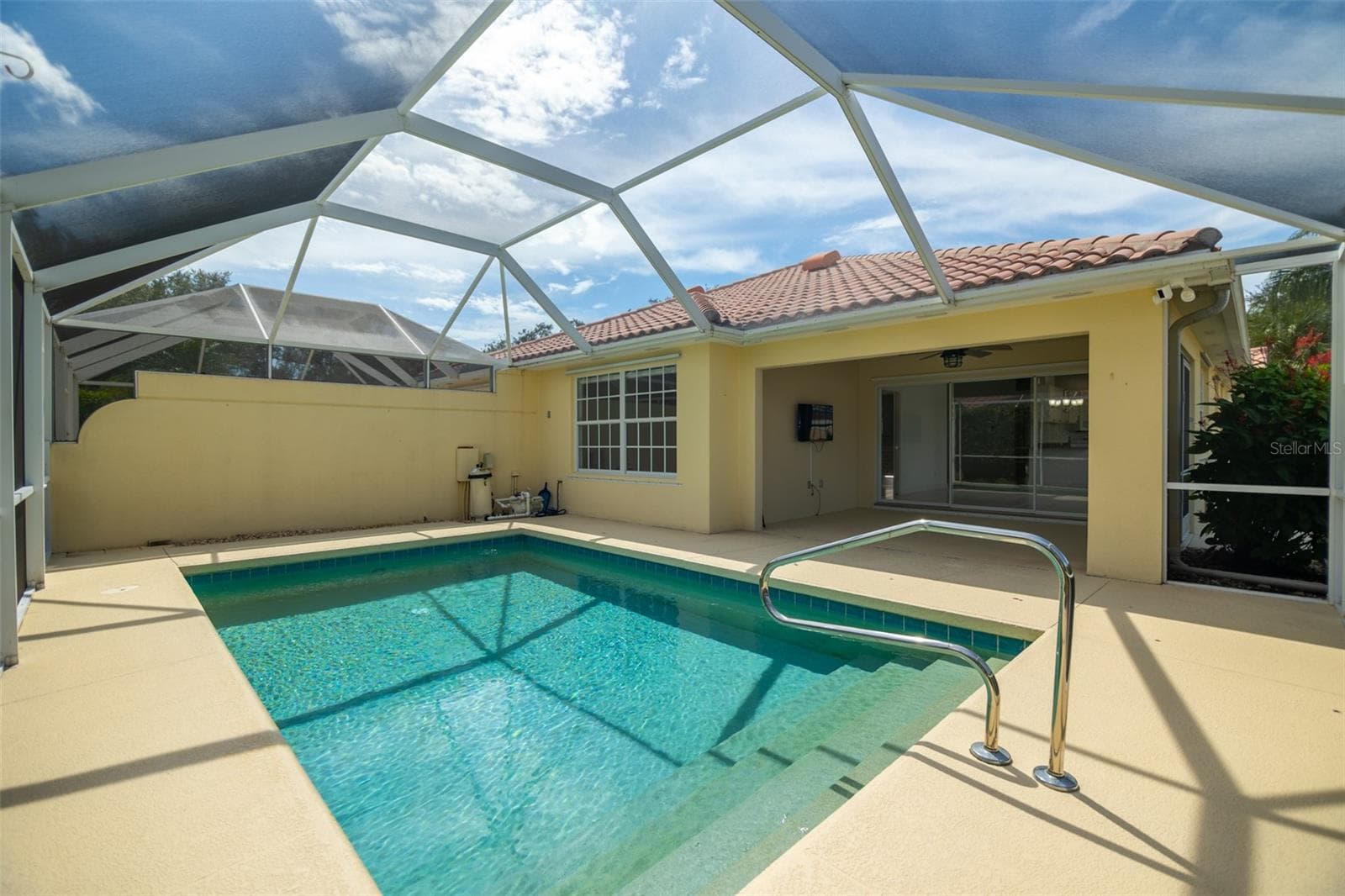 Pool, pool equipment, and a coverd back patio. - 8876 ESTEPONA CT, SARASOTA