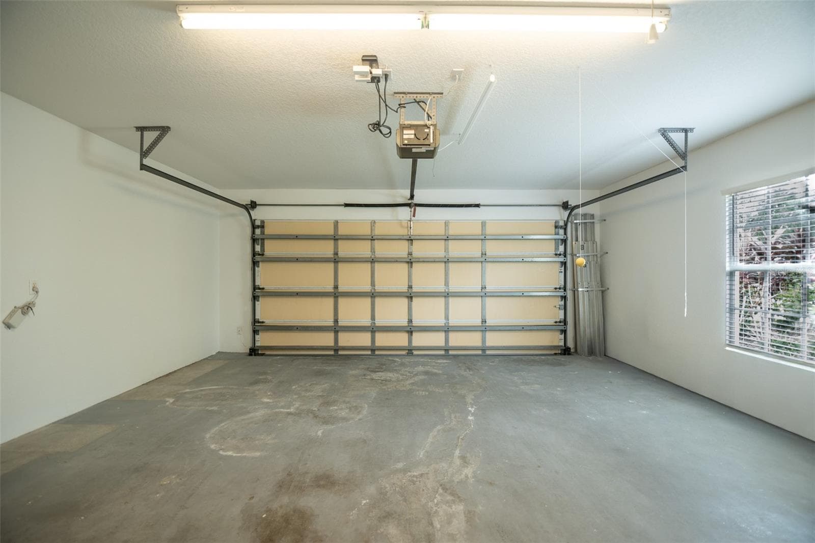 Garage with a window. - 8876 ESTEPONA CT, SARASOTA