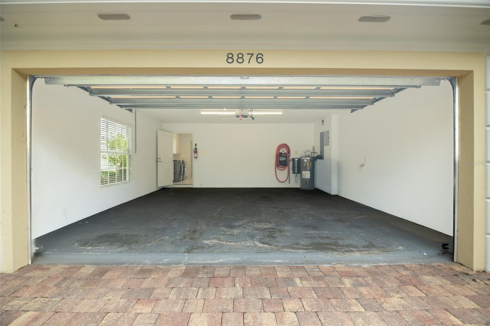 Front of garage looking into laundry room. - 8876 ESTEPONA CT, SARASOTA