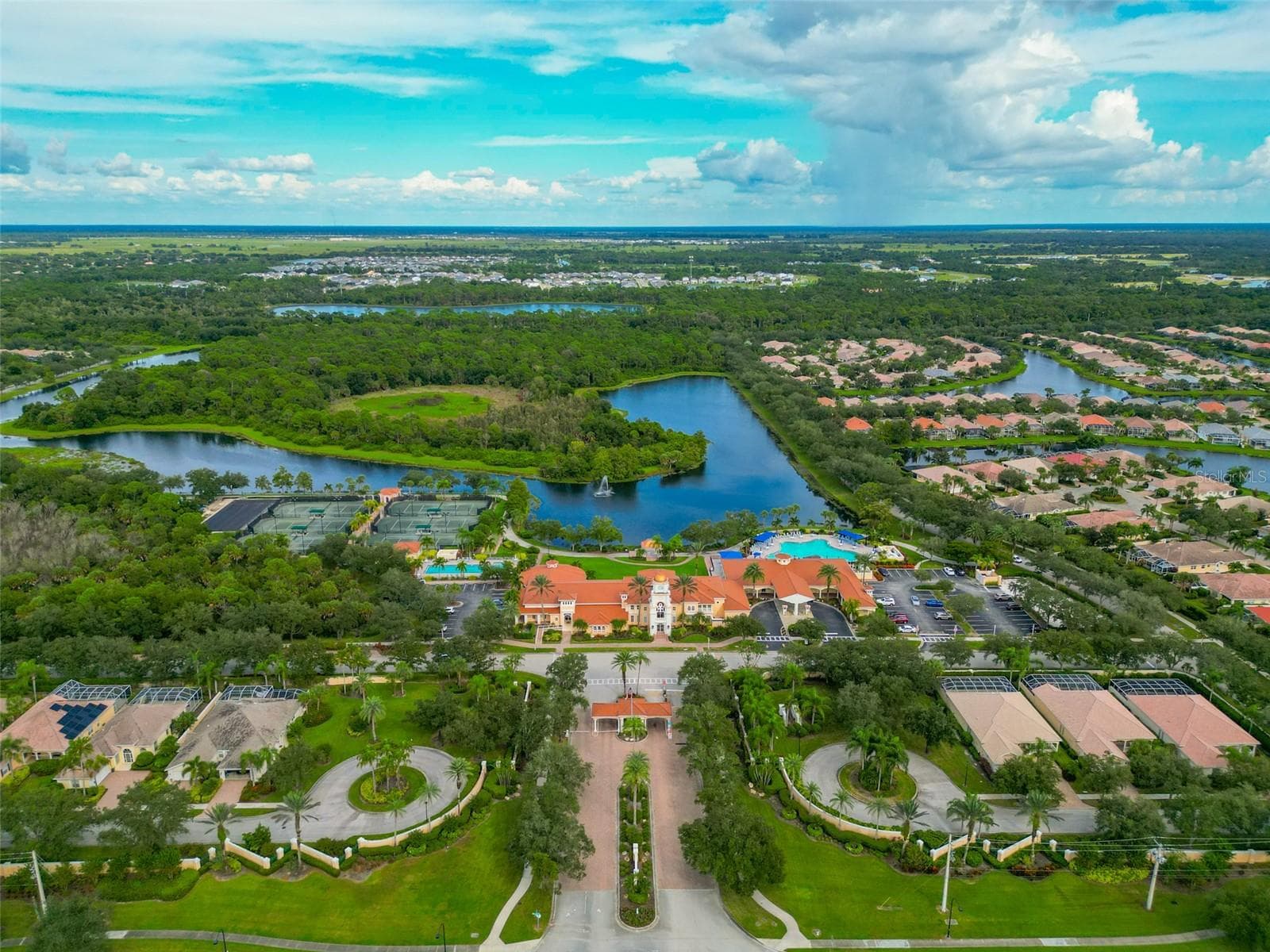 Front on sky view of neighborhood and recreational facilities. - 8876 ESTEPONA CT, SARASOTA