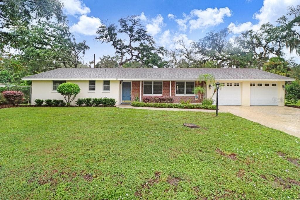 Front exterior of home with attached two-car garage - 12108 N 53RD ST, TEMPLE TERRACE