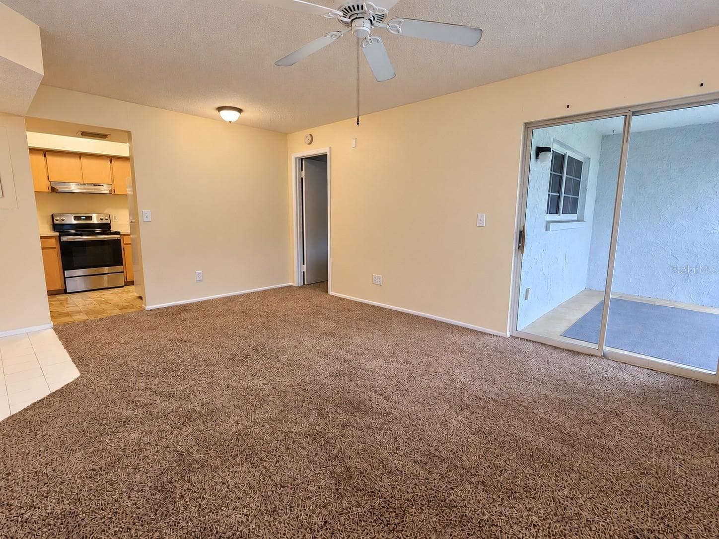Living Room to Kitchen - 580 FAIRWAYS LN #G204, OCALA