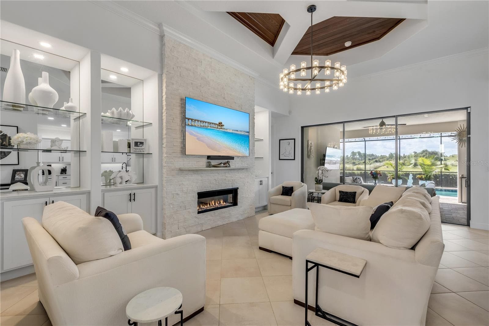 Gas fireplace with stacked stone surround. - 189 ASPEN WAY, PALM COAST