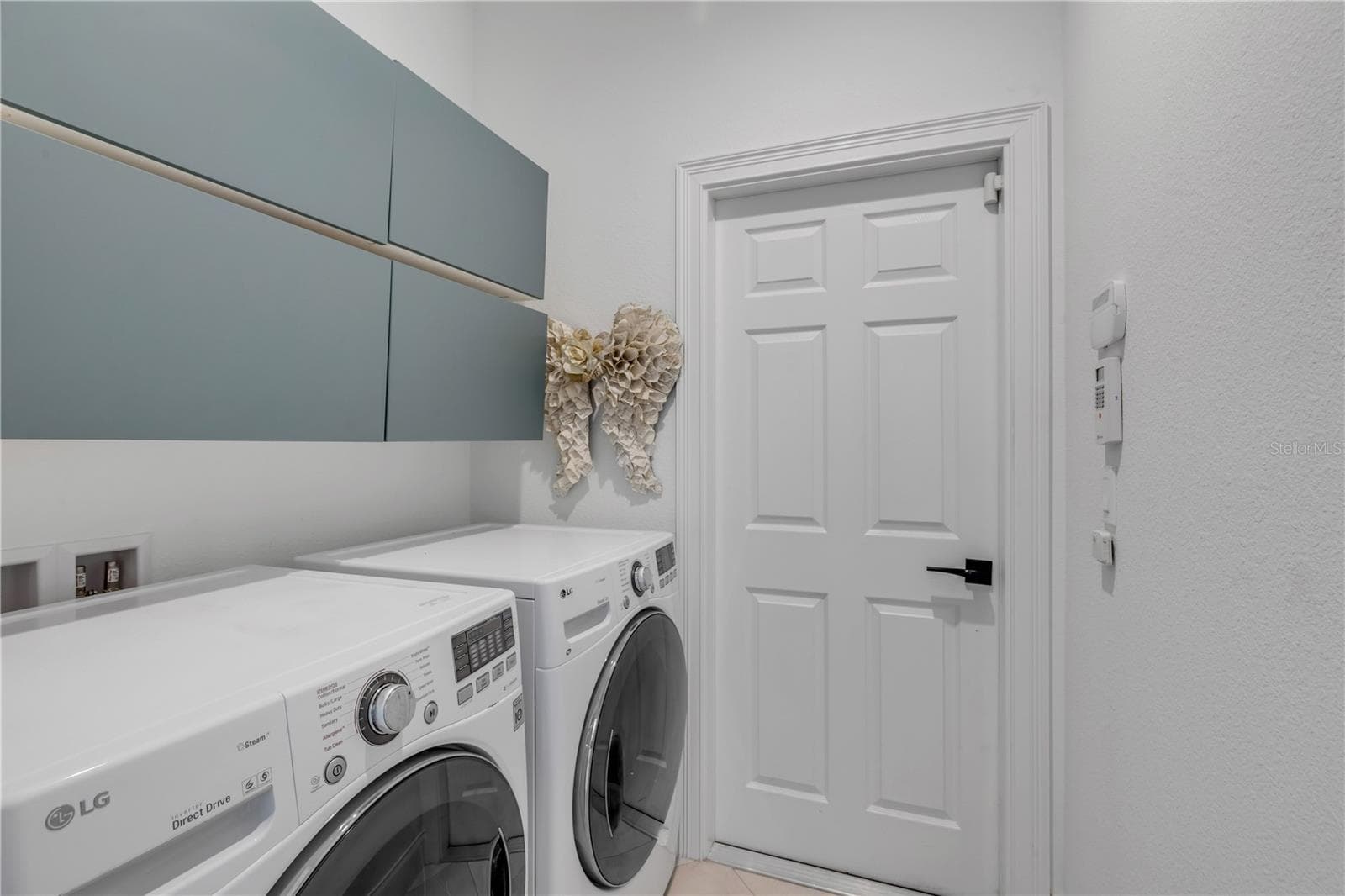 Laundry Room off garage and guest wing. - 189 ASPEN WAY, PALM COAST