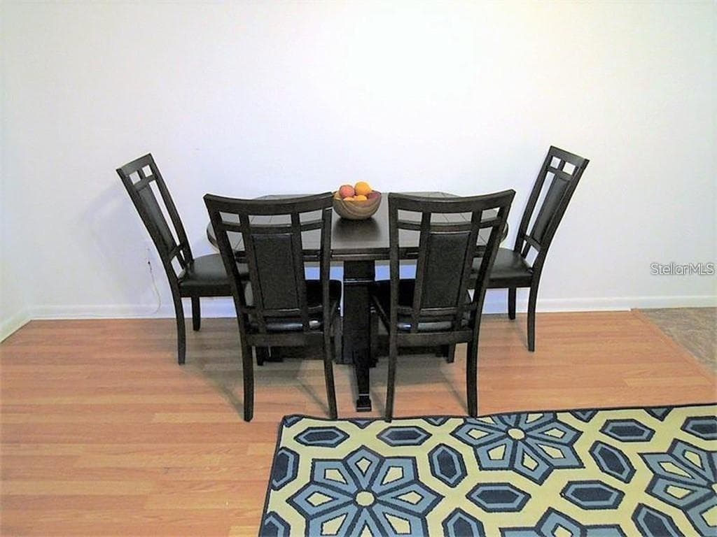 Dining area with extended length of the table.... - 5810 21ST ST N #15, ST PETERSBURG