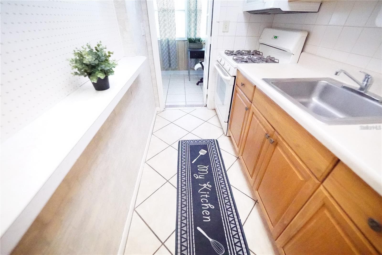 Kitchen with kitchen flooring visible - 5810 21ST ST N #15, ST PETERSBURG