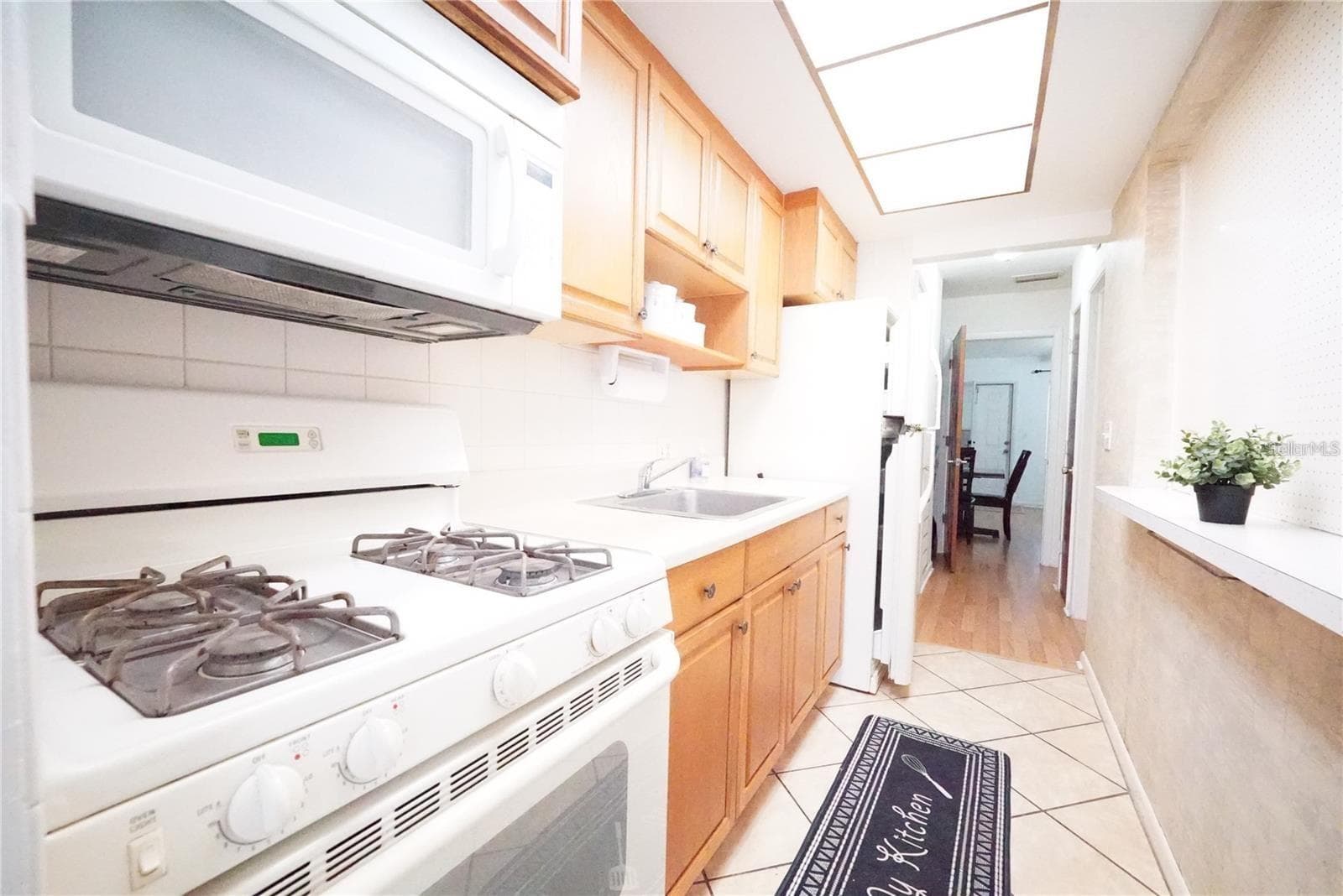 Kitchen with view toward living-dining room. - 5810 21ST ST N #15, ST PETERSBURG