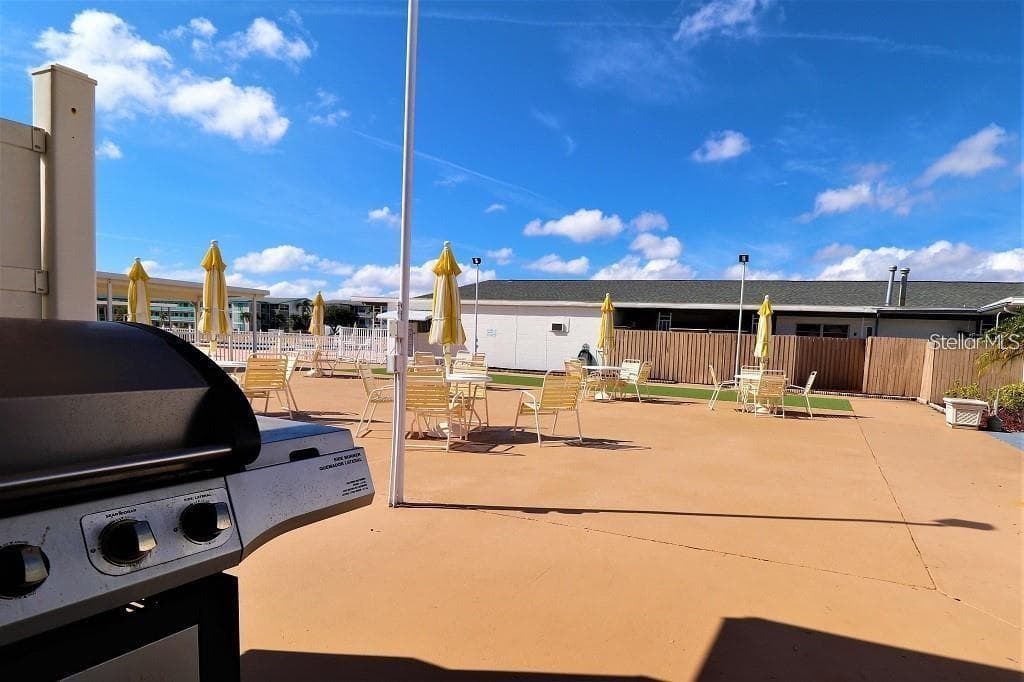 Grilling area by swimming pool. - 5810 21ST ST N #15, ST PETERSBURG