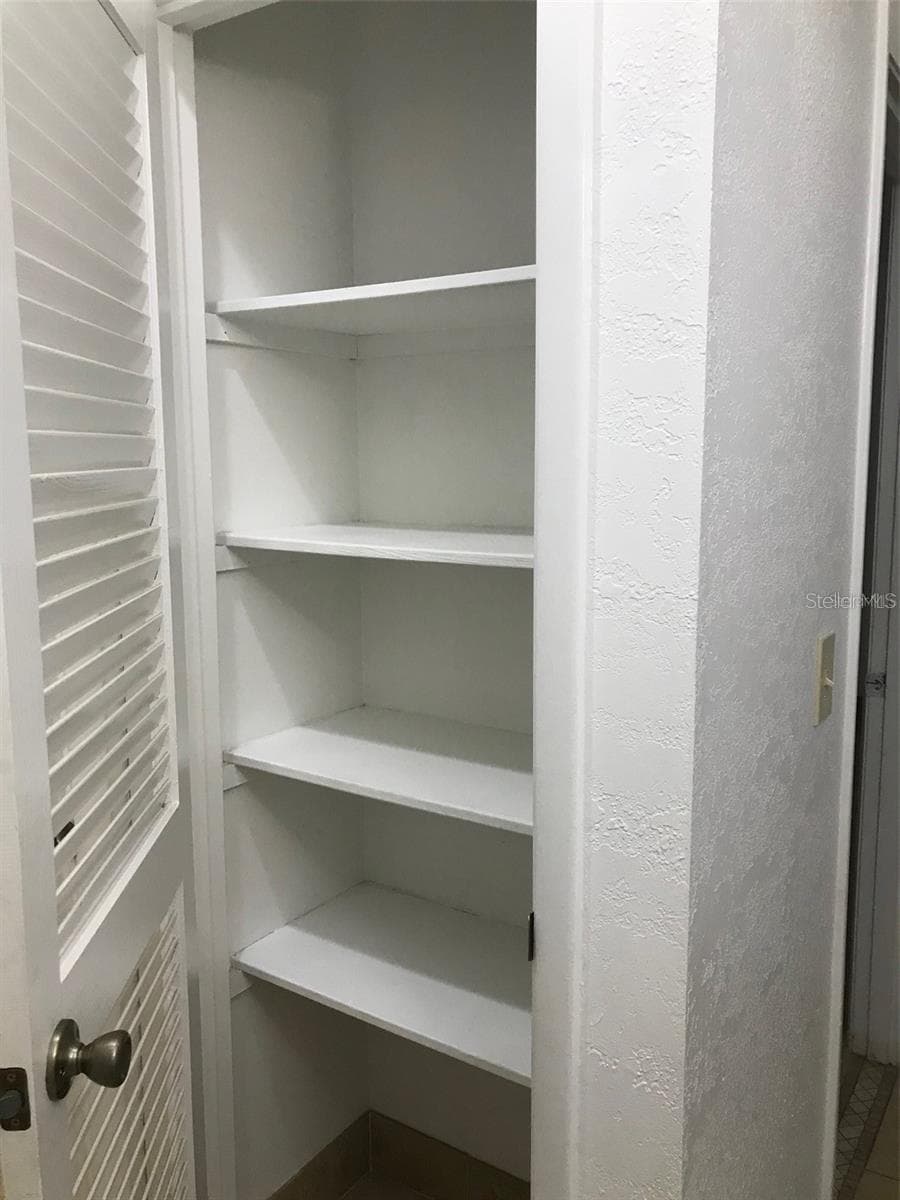 LINEN CLOSET - HALL OFF GUEST BATH - 23040 JUMPER AVE, PORT CHARLOTTE