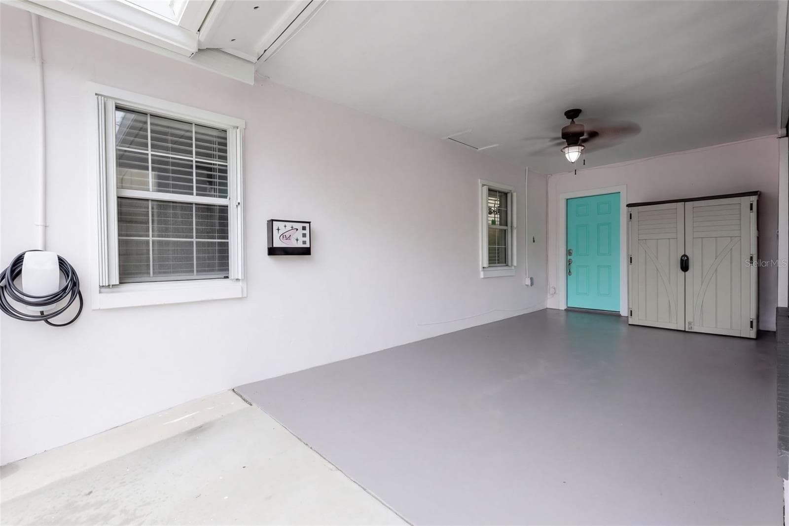 Carport with Tesla Charging Connector Installed - 107 NE IVANHOE BLVD, ORLANDO