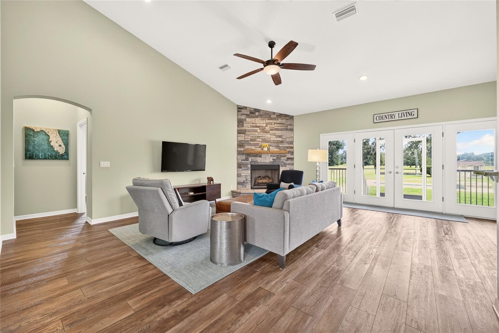 Open concept living area enjoys natural light and beautiful views of the east pastures. - 2556 NE 120TH ST, ANTHONY