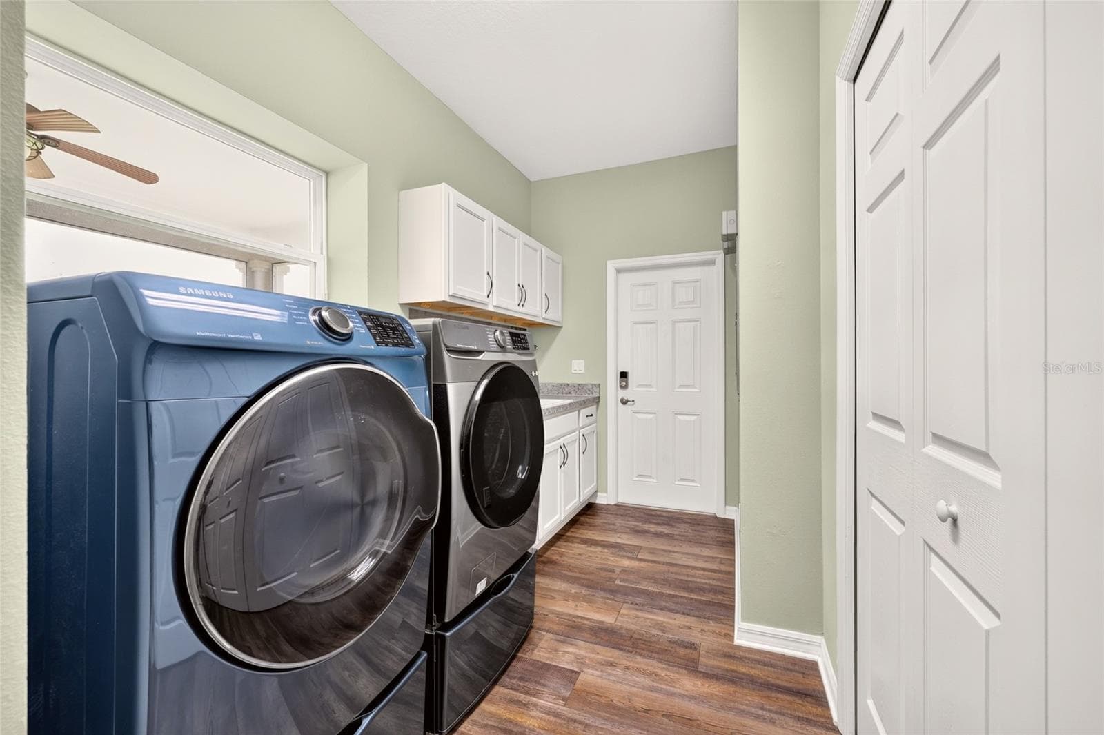 Large Laundry offers another storage closet, cabinet space, washtub, and direct access to the side yard - perfect for pets! - 2556 NE 120TH ST, ANTHONY