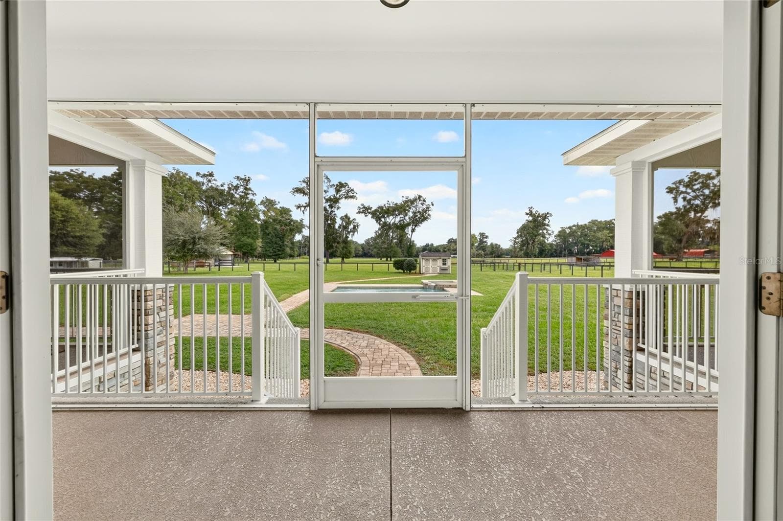 Expansive rear screened porch. - 2556 NE 120TH ST, ANTHONY