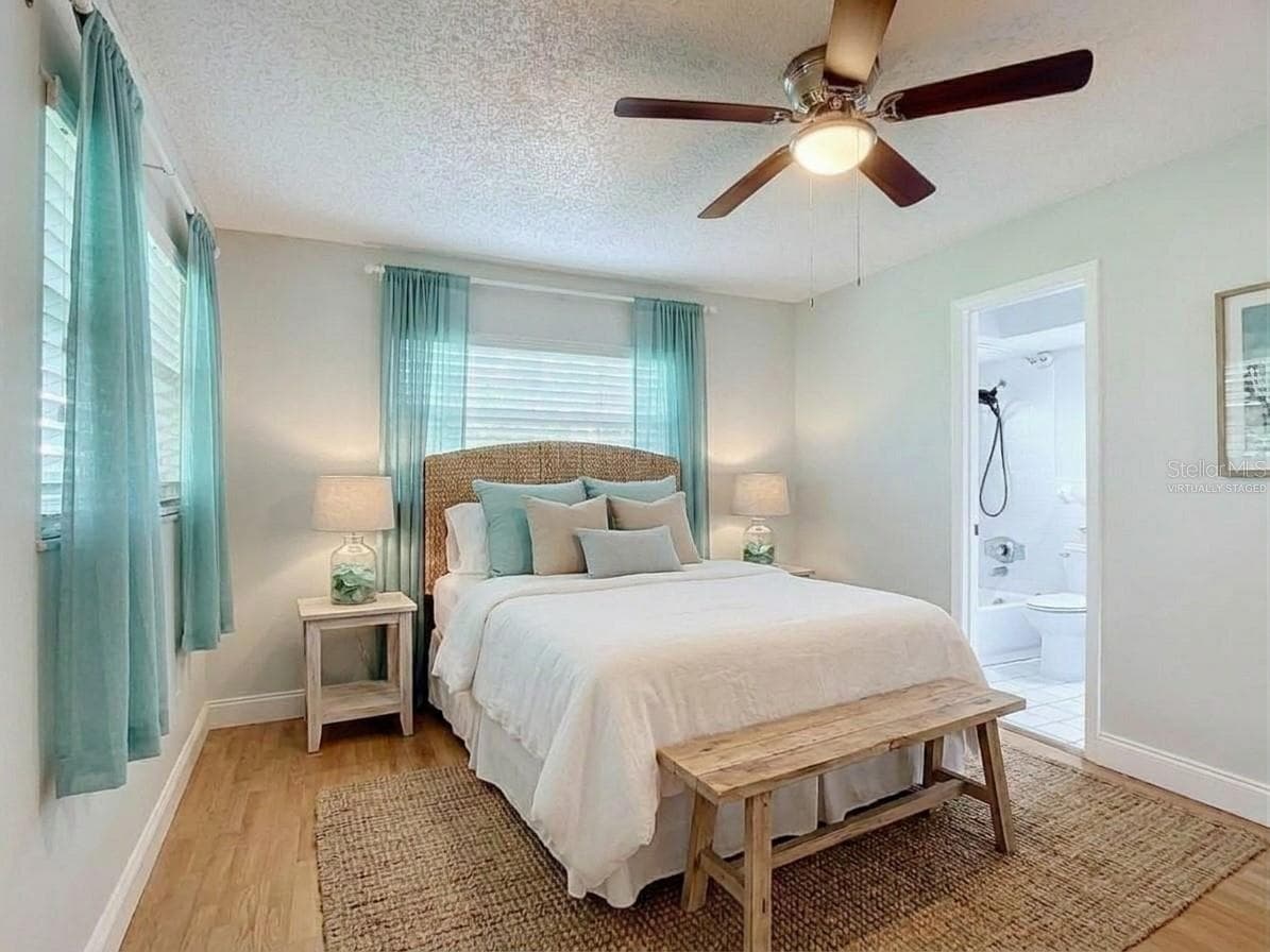 Virtually staged primary bedroom. - 112 10TH ST, ST CLOUD