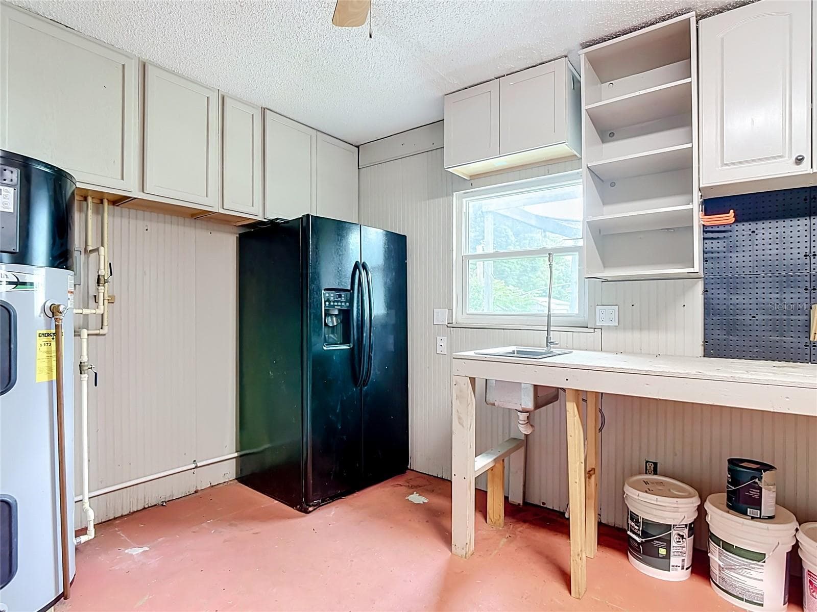 Refrigerator in garage conveys. - 112 10TH ST, ST CLOUD
