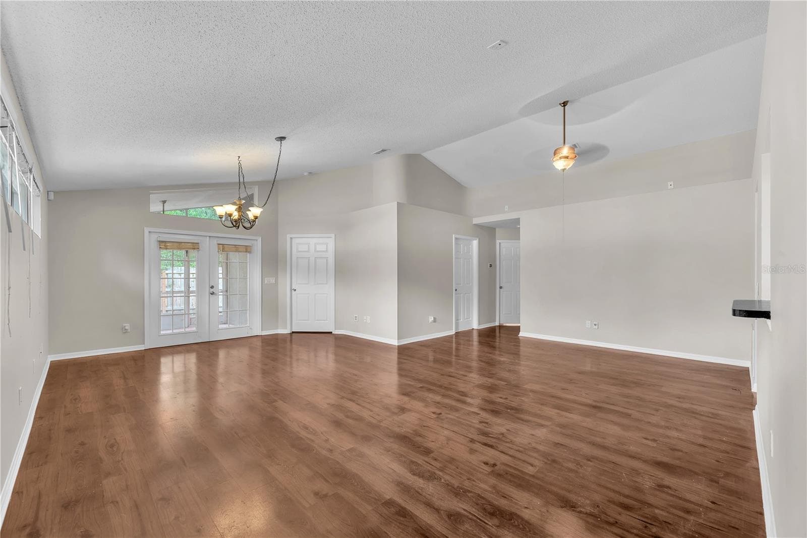 Notice the pass thru window and there's also a walk thru opening into the dining area in the great room plan. French doors lead to the back yard. - 4002 LEVONSHIRE PL, VALRICO