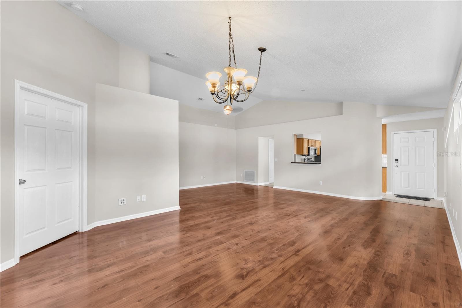 Easy to keep laminate flooring throughout all of the living areas with tile in the wet areas. - 4002 LEVONSHIRE PL, VALRICO