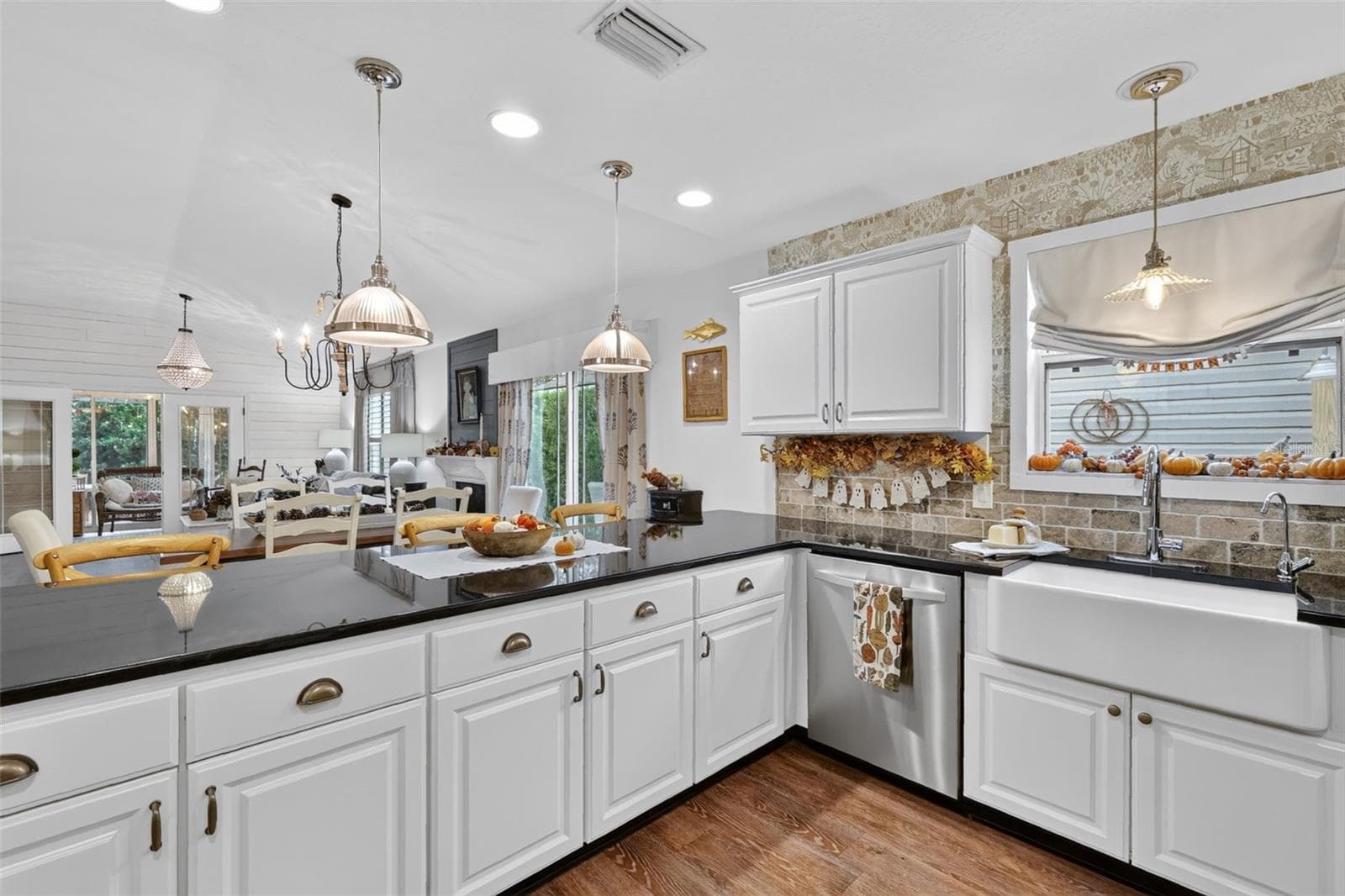 Generous Breakfast Bar Opening to Dining and Living Room - 1700 JADESTONE TER, THE VILLAGES