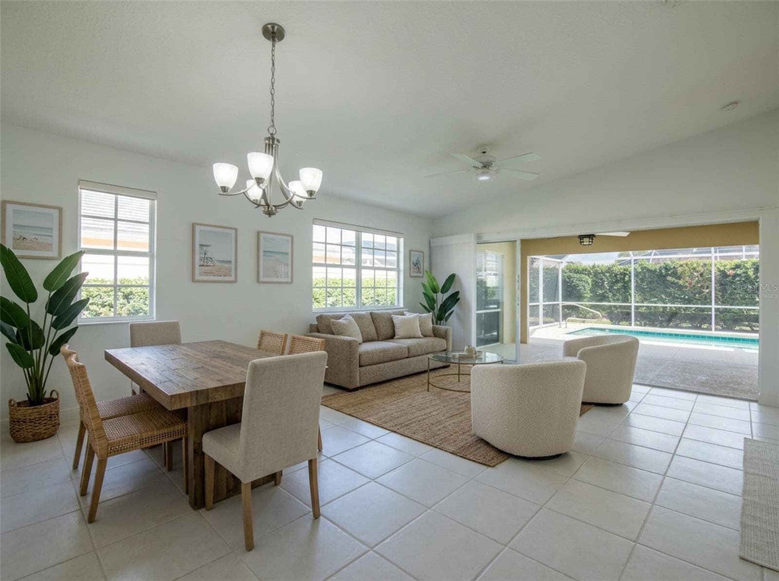 Virtually Staged Dining and Living Room with views to the Pool. - 8876 ESTEPONA CT, SARASOTA