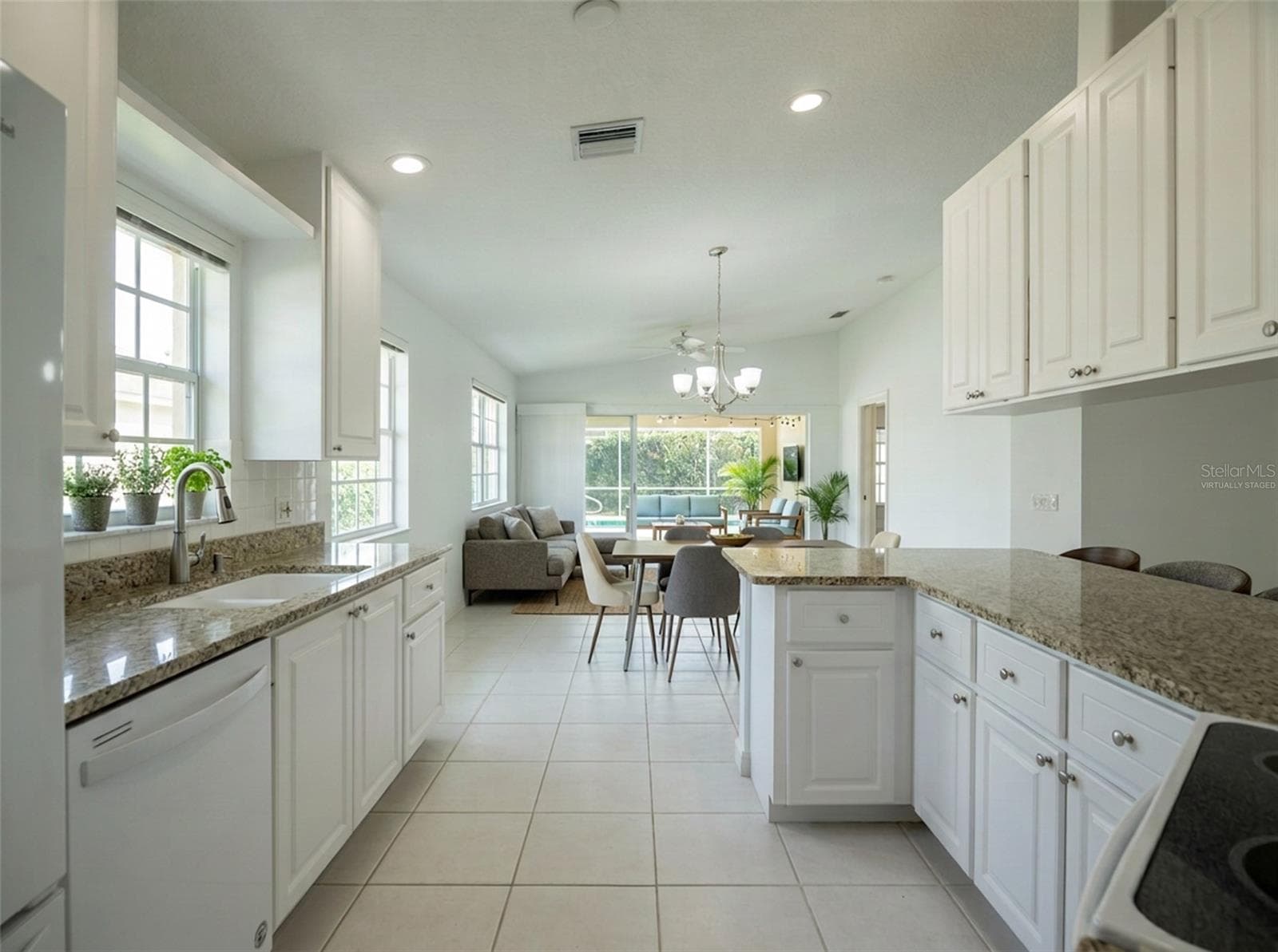 Virtually Staged dining and living room - 8876 ESTEPONA CT, SARASOTA