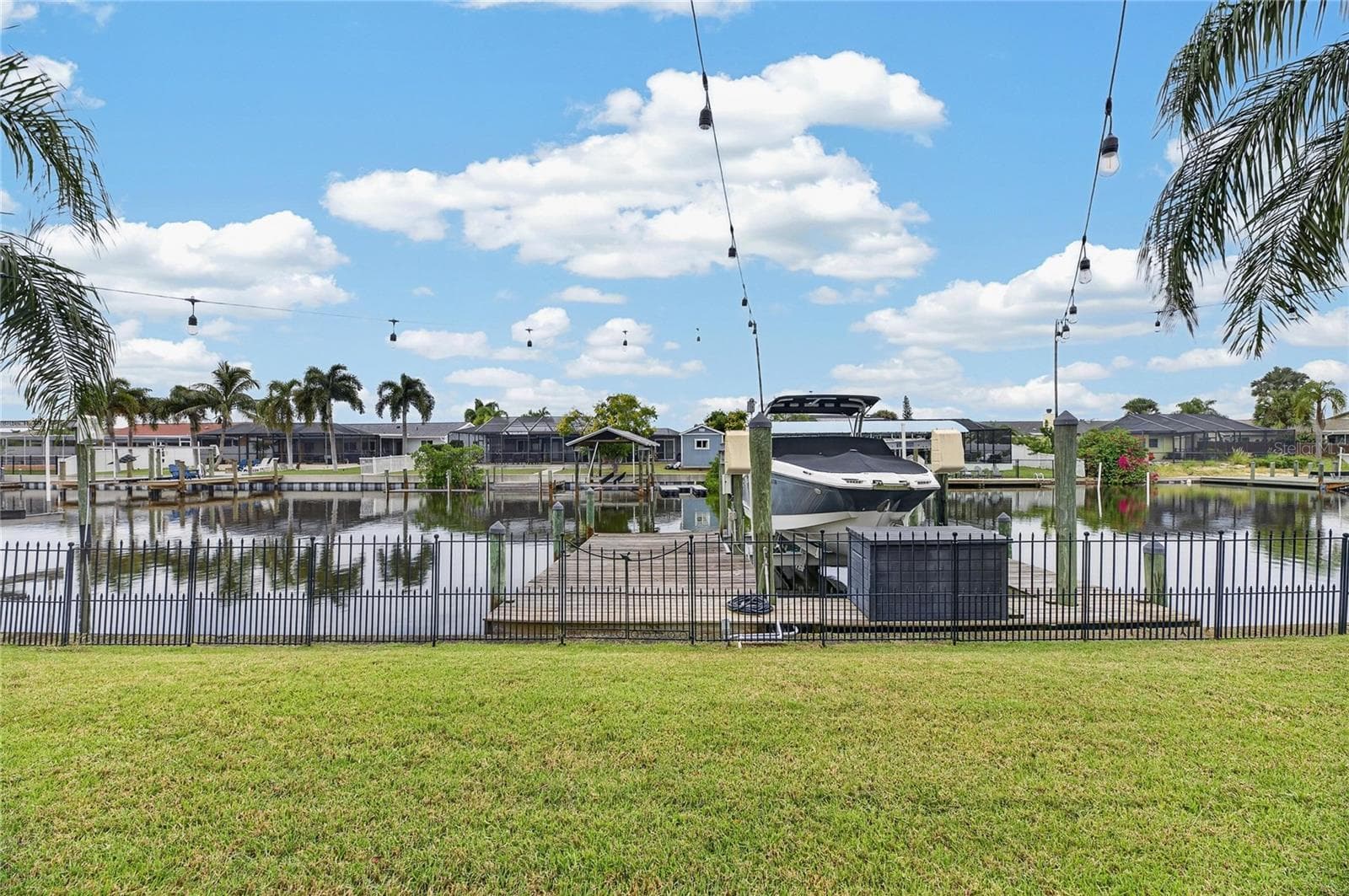 Wood Dock, Wrapped Pilings & A 10,000lb Lift! AND The Deck Box Stays! - 6510 SOLITAIRE PALM WAY, APOLLO BEACH