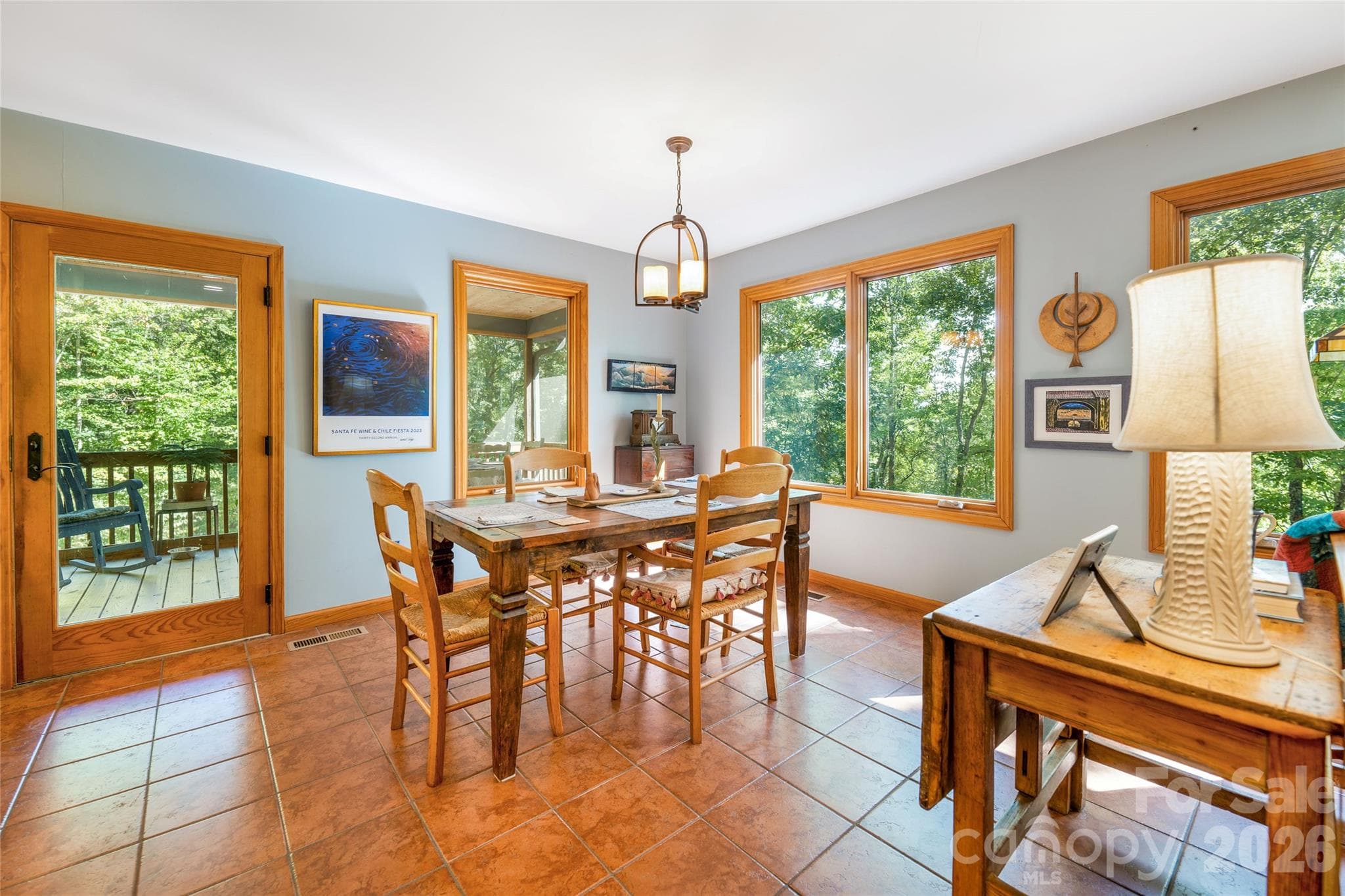 Dining area is surrounded by natural light. - 115 Laurel Wood Drive, Mars Hill