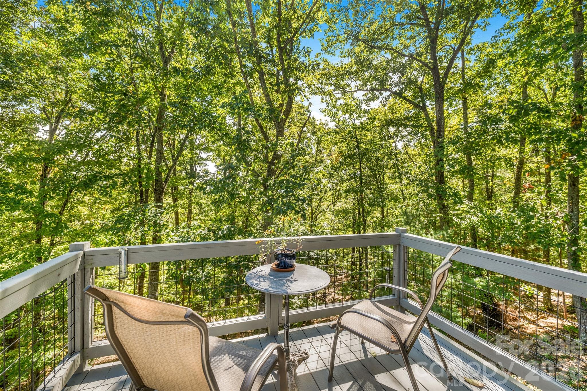 Outside sitting area off primary bedroom. - 115 Laurel Wood Drive, Mars Hill