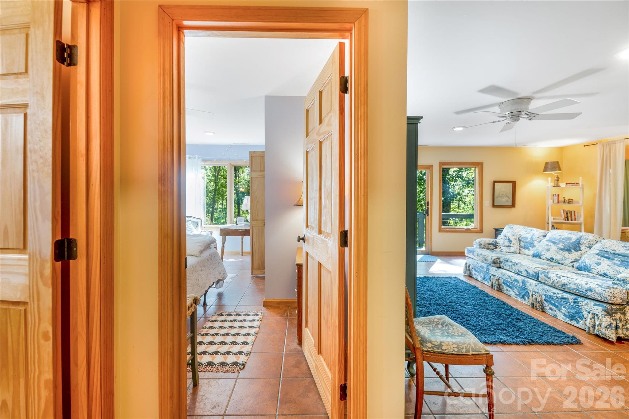 Lower level with one bedroom, a full bathroom, and a family room which includes two nooks for extra sleeping space! - 115 Laurel Wood Drive, Mars Hill