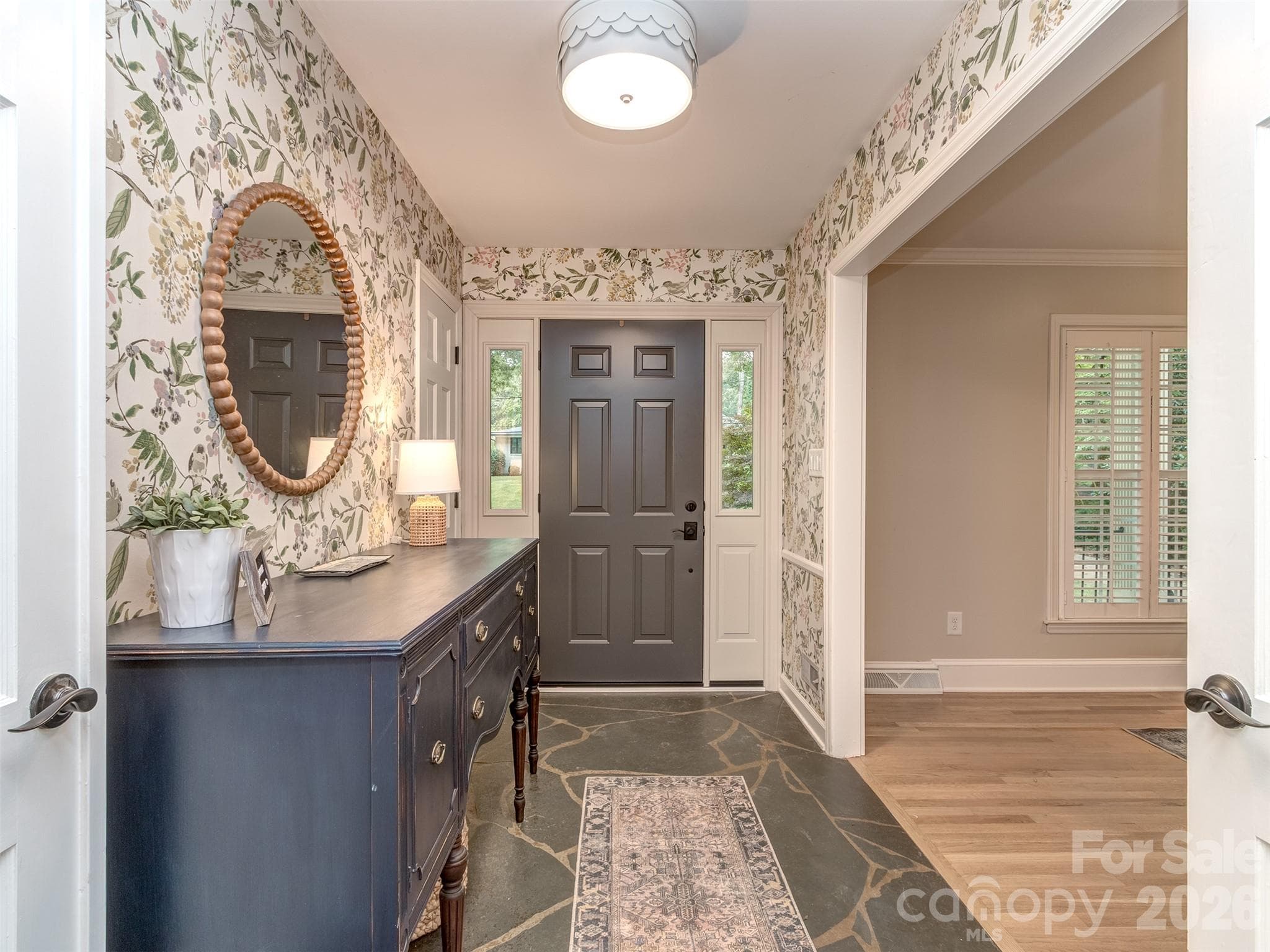The slate foyer welcomes you into this completely updated and reimagined home! - 6129 Page Court, Charlotte
