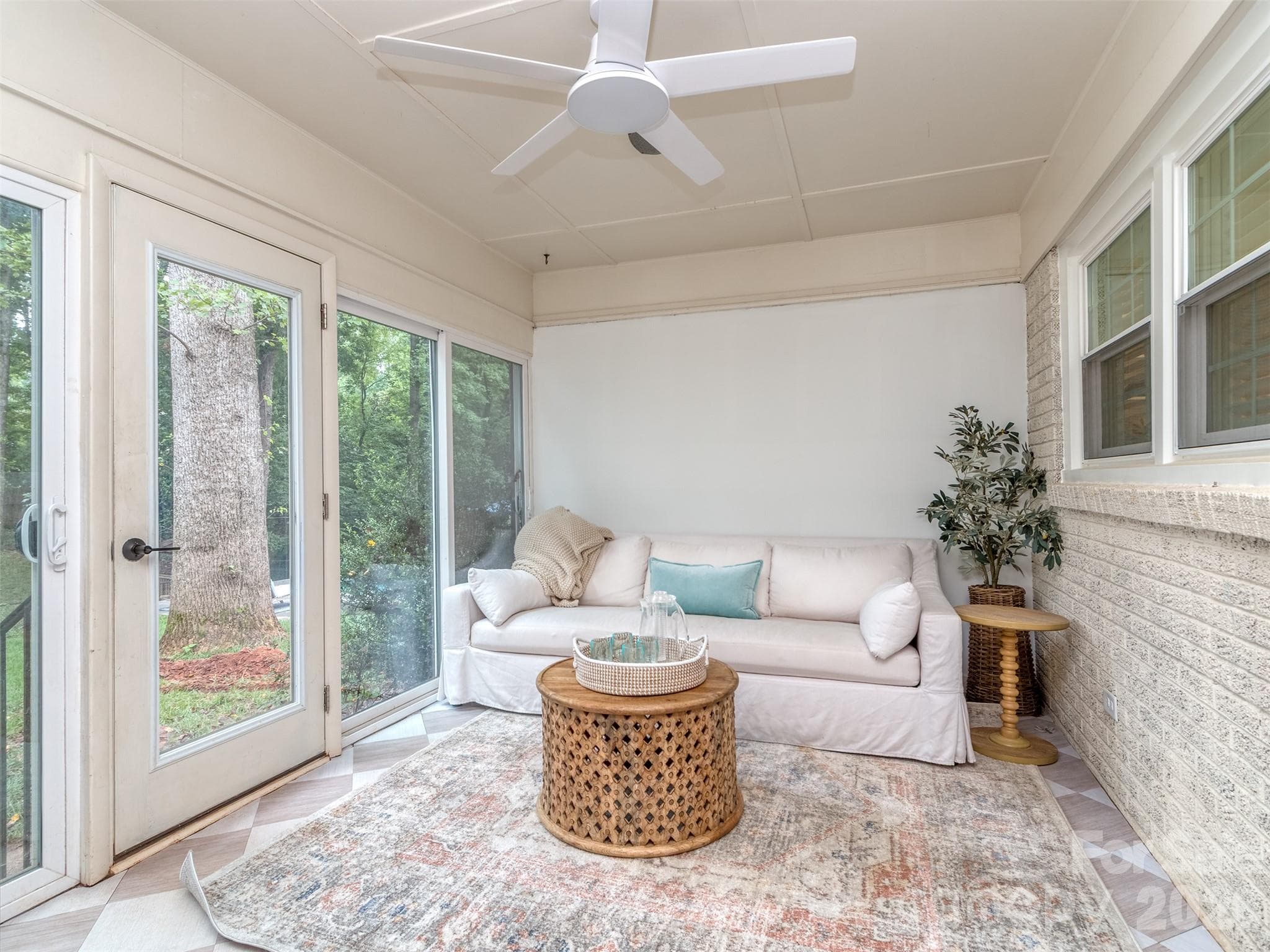 The sun room is the perfect place for a nap year round! Whether Spring is in the air or Winter Snow is falling outside, you will never be uncomfortable here! - 6129 Page Court, Charlotte