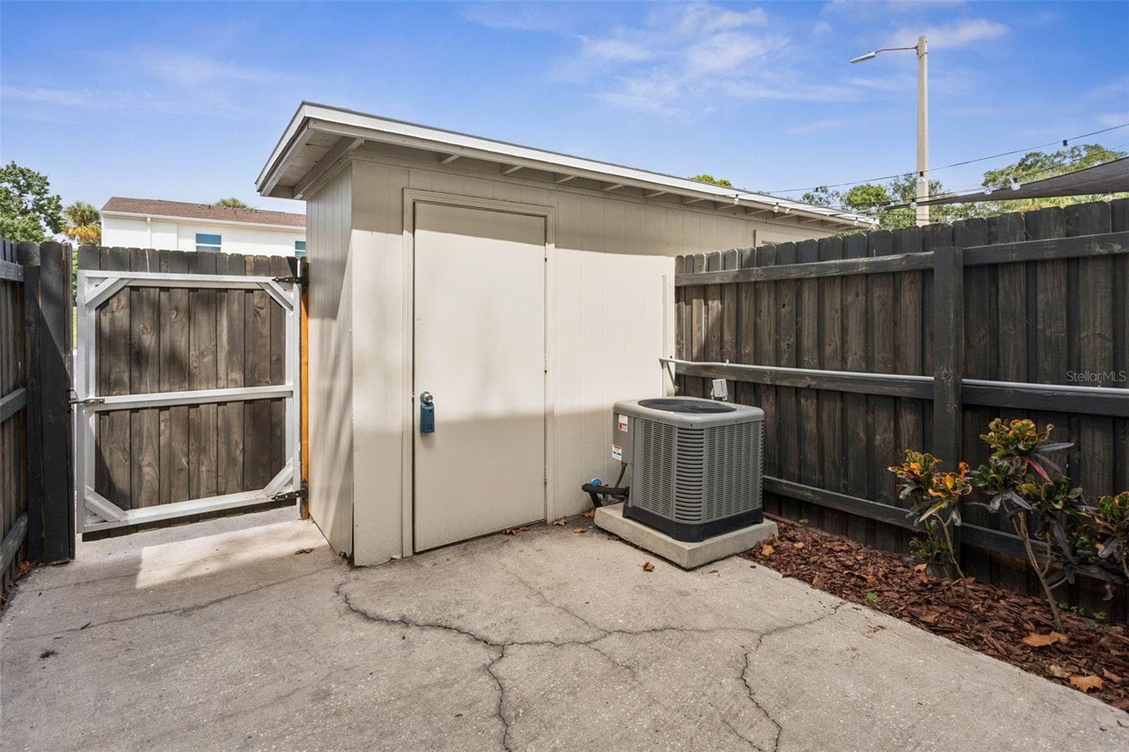 back patio reverse angle showing shed - 4219 LA SORRENTO CT, TAMPA