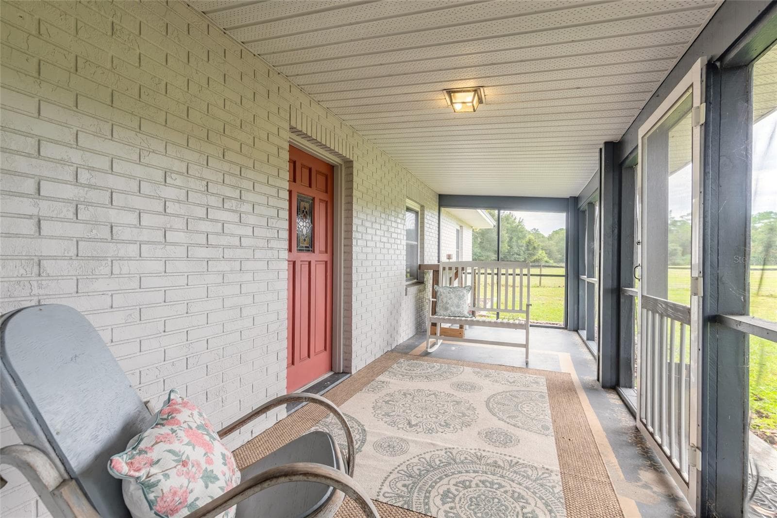 Screened front porch - 1390 E OHIO AVE, LAKE HELEN